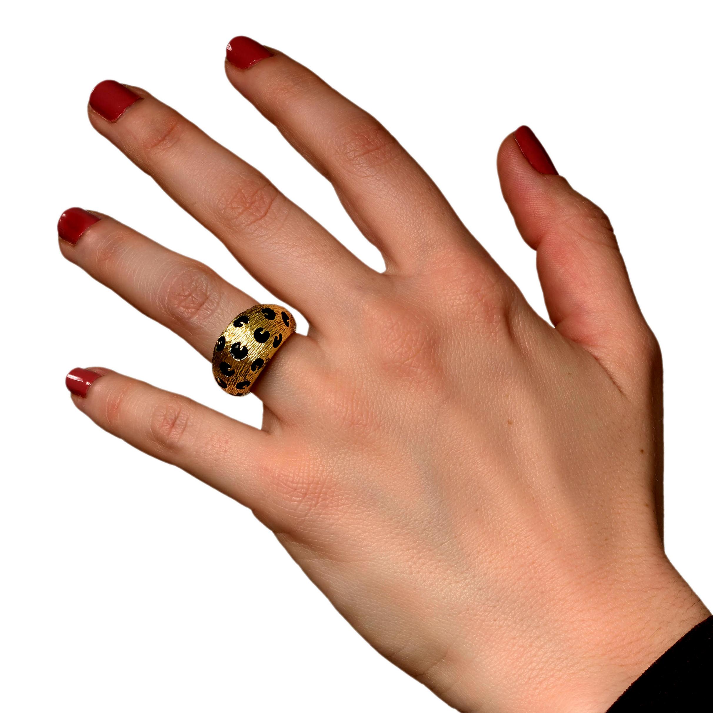 A fabulous vintage Fred of Paris ring showcasing leopard spots filled with black enamel and 18k yellow gold. The ring measures a size EU 48 and can be resized.