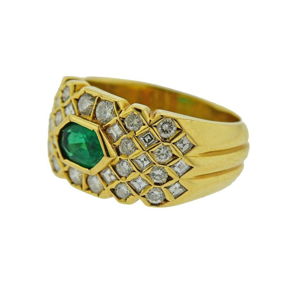 18k gold Fred Paris ring, featuring approx. 4mm x 6.2mm emerald, surrounded with approx. 0.68ctw in diamonds. Ring size -  5.5, ring top is 10.5mm wide. Marked 750, Fred, Paris. Weight is 7.8 grams. 