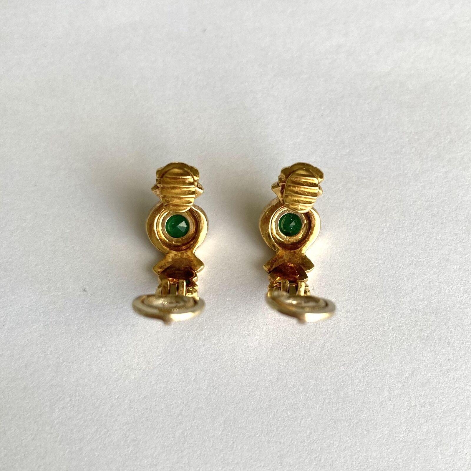 Fred Paris 18k Yellow Gold & Emerald Hoop Earrings Clip On Circa 1980s Vintage

Here is your chance to purchase a beautiful and highly collectible designer pair of earrings.  

The earrings weigh 10.7 grams and are fully hallmarked with vintage