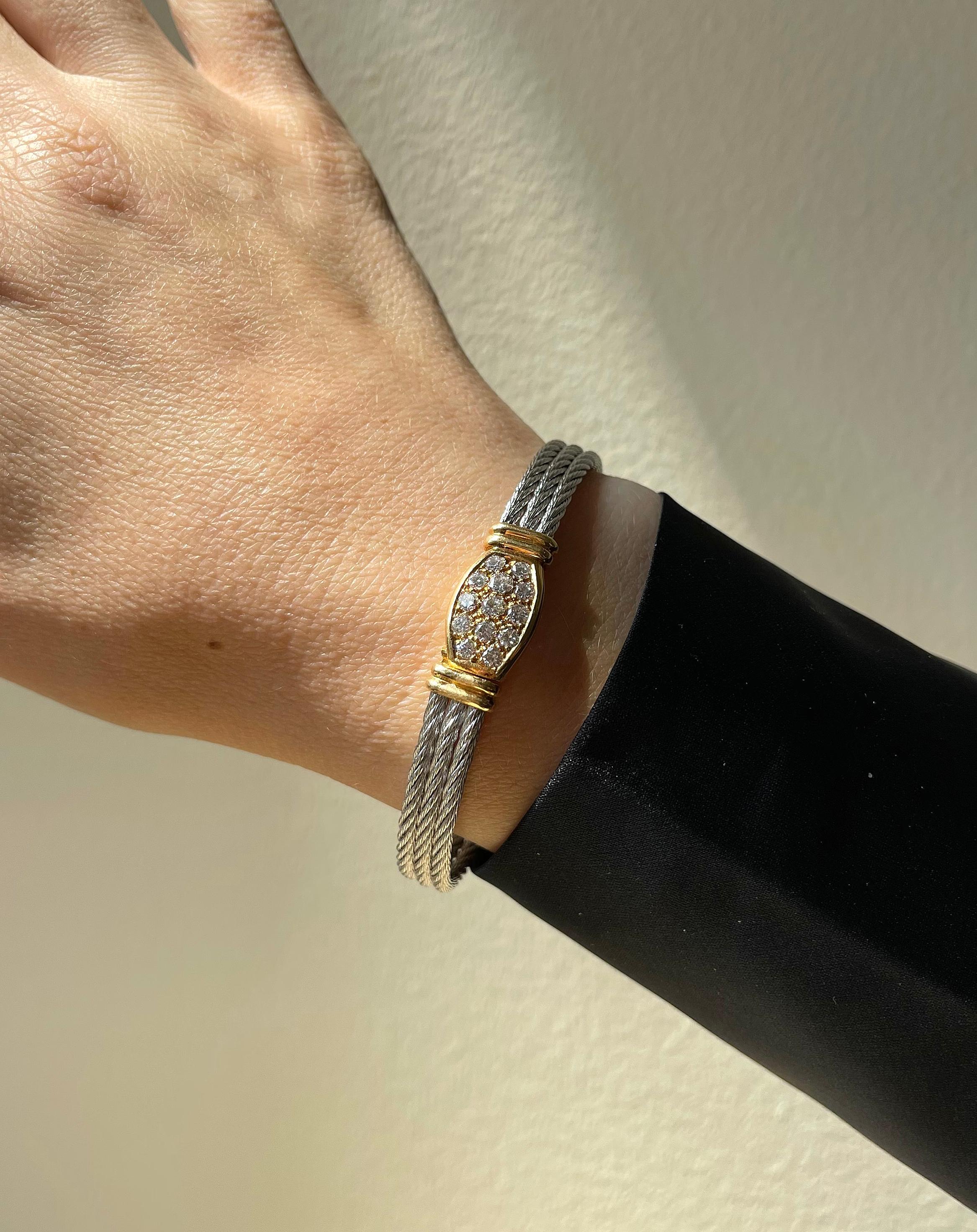 18k gold and stainless steel cord bracelet by Fred Paris, with approx. 0.95ctw G/VS diamonds. Bracelet will fit approx. 7