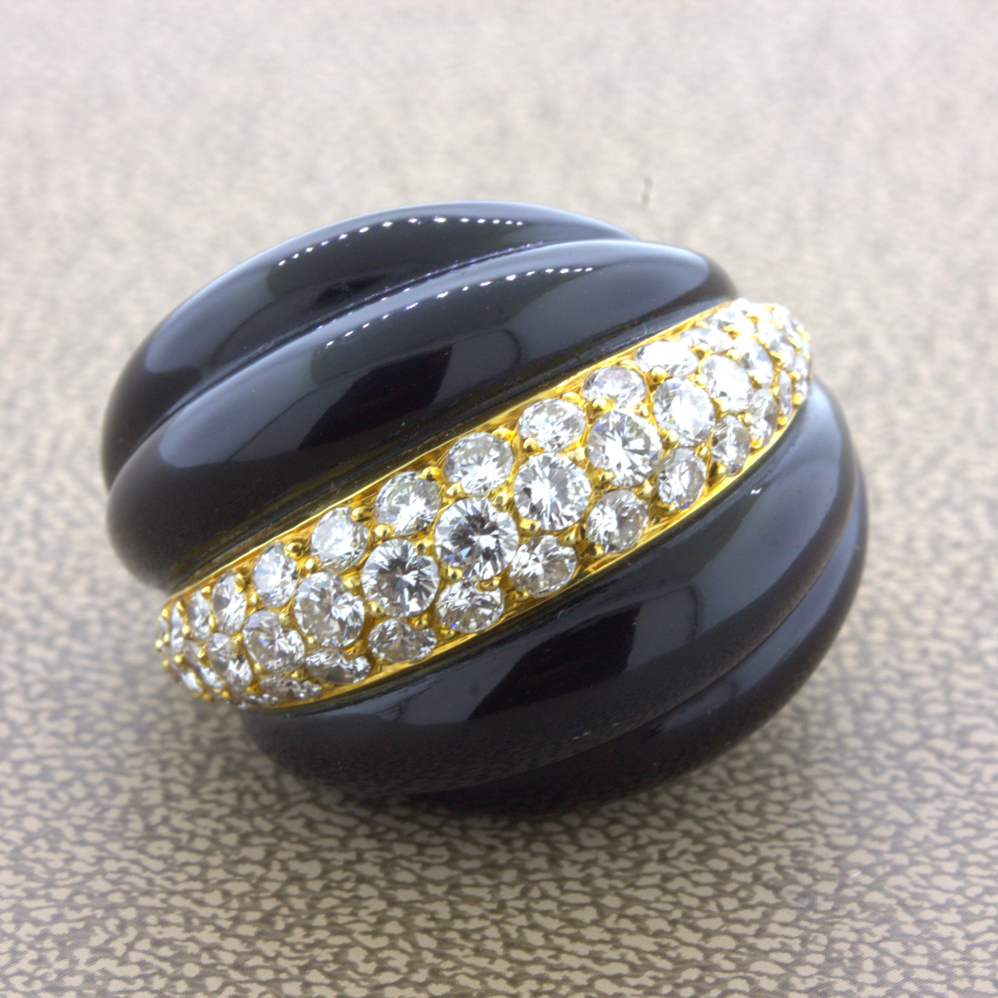 Fred Paris Diamond Onyx 18K Yellow Gold Cocktail Ring, French

A chic and elegant cocktail ring by Fred Paris. It features 2 pieces of hand-carved and polished black onyx which are smooth with waves. In between them are a bright row of round