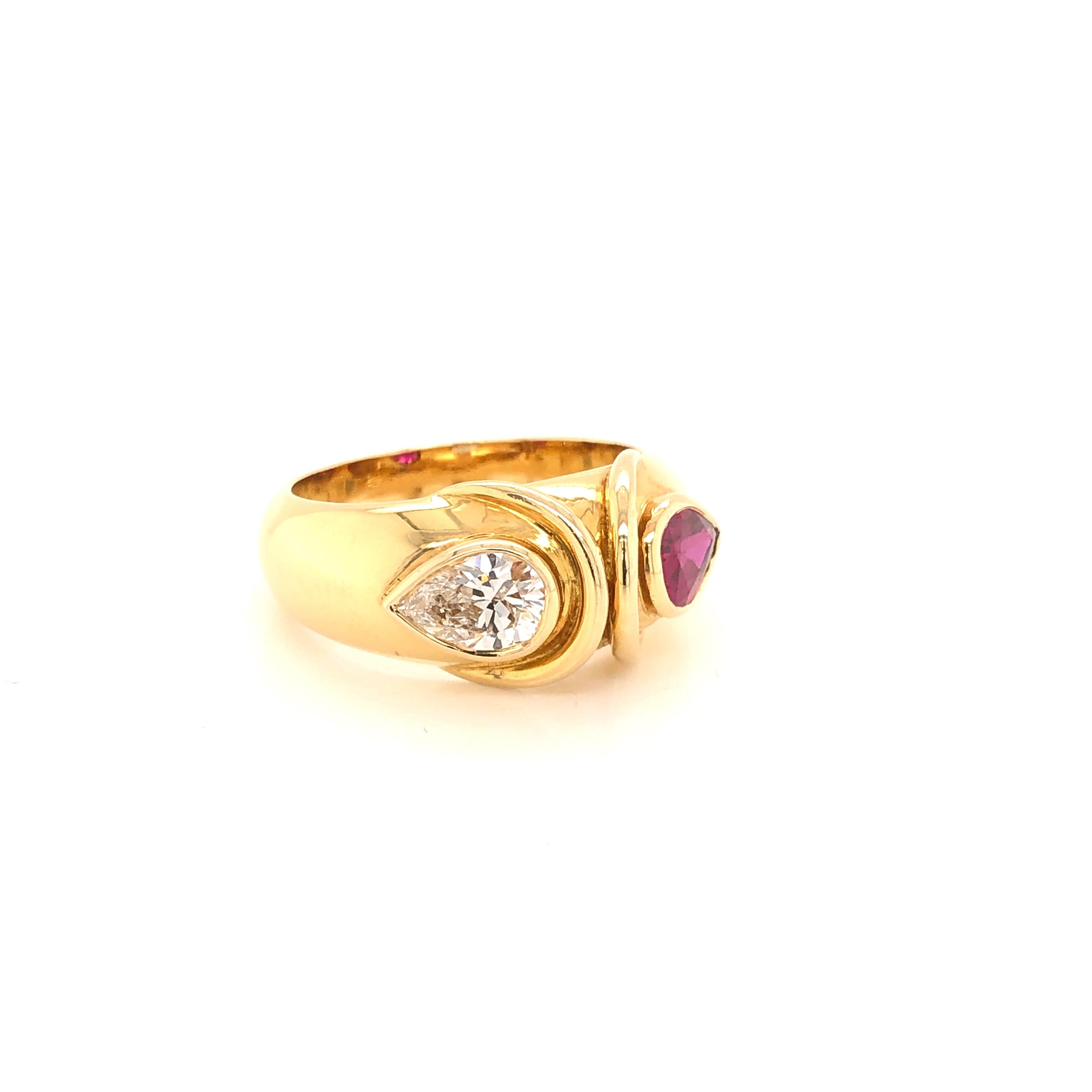 Amazing design from the jewelry house FRED.  This amazing ring is handcrafted in 18k yellow gold. The wide band design showcases two gemstones Diamond and Ruby.  Simplistic yet elegant, this ring is sure to stand out whenever worn. The Diamond is