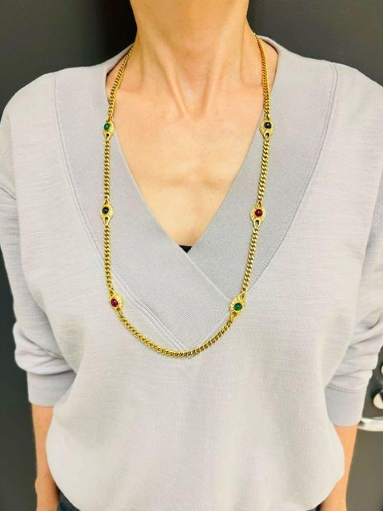 Elegant and classy necklace created by Fred, Paris in the 1980s. Timeless and wearable, the necklace is a great addition to your jewelry collection. 
It is made of 18 karat yellow gold and set with cabochon ruby, emerald and sapphire accented with