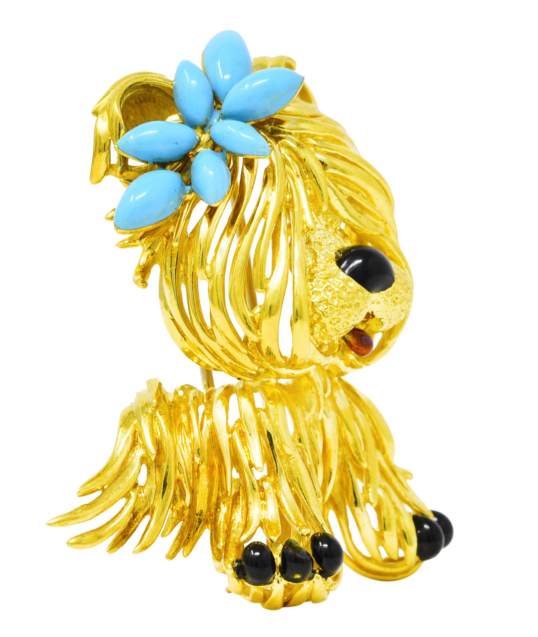 Substantial brooch is a dimensionally formed Maltese dog with stylized polished gold fur. Muzzle is stippled gold with a guilloche enamel tongue. With an opaque black enamel nose matched paws. Dog is topped by a clustered floral bow glossed with