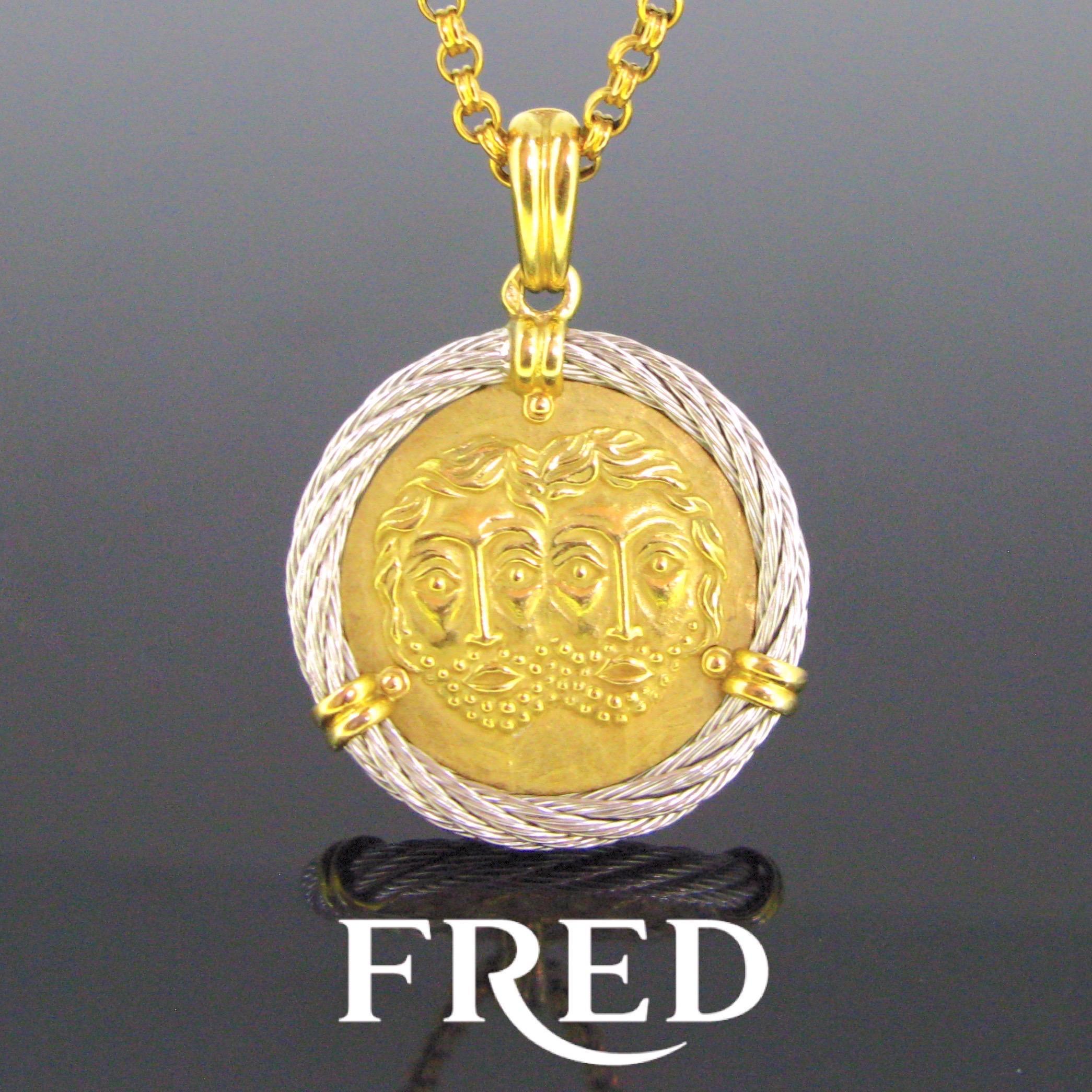 Weight:	18.8


Metal:	18kt yellow Gold 


Signature:	Fred Paris
	

Condition:	Very Good


Hallmarks:	French – eagle’s head
	

Comments:	This pendant is from the Force 10 Collection by Fred. It is the Gemini zodiac sign; it is made in 18kt gold and