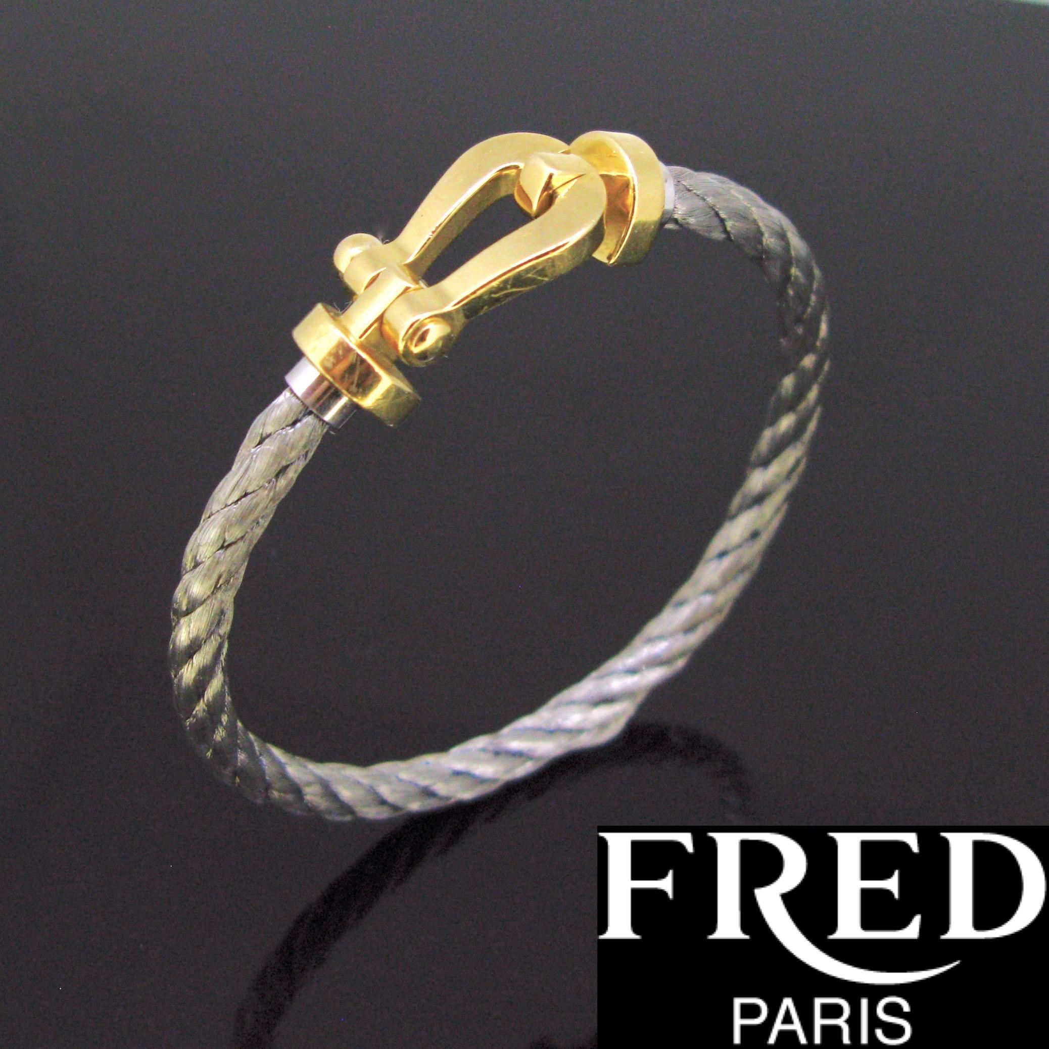 Weight:	18.79 gr Steel 
		11.02gr Red Corderie


Metal:	18kt yellow Gold 


Signature:	Fred Paris, nº1218133
	

Condition:	Very Good


Hallmarks:	French – eagle’s head
	

Comments:	This bracelet is from the famous collection Force 10 designed by the