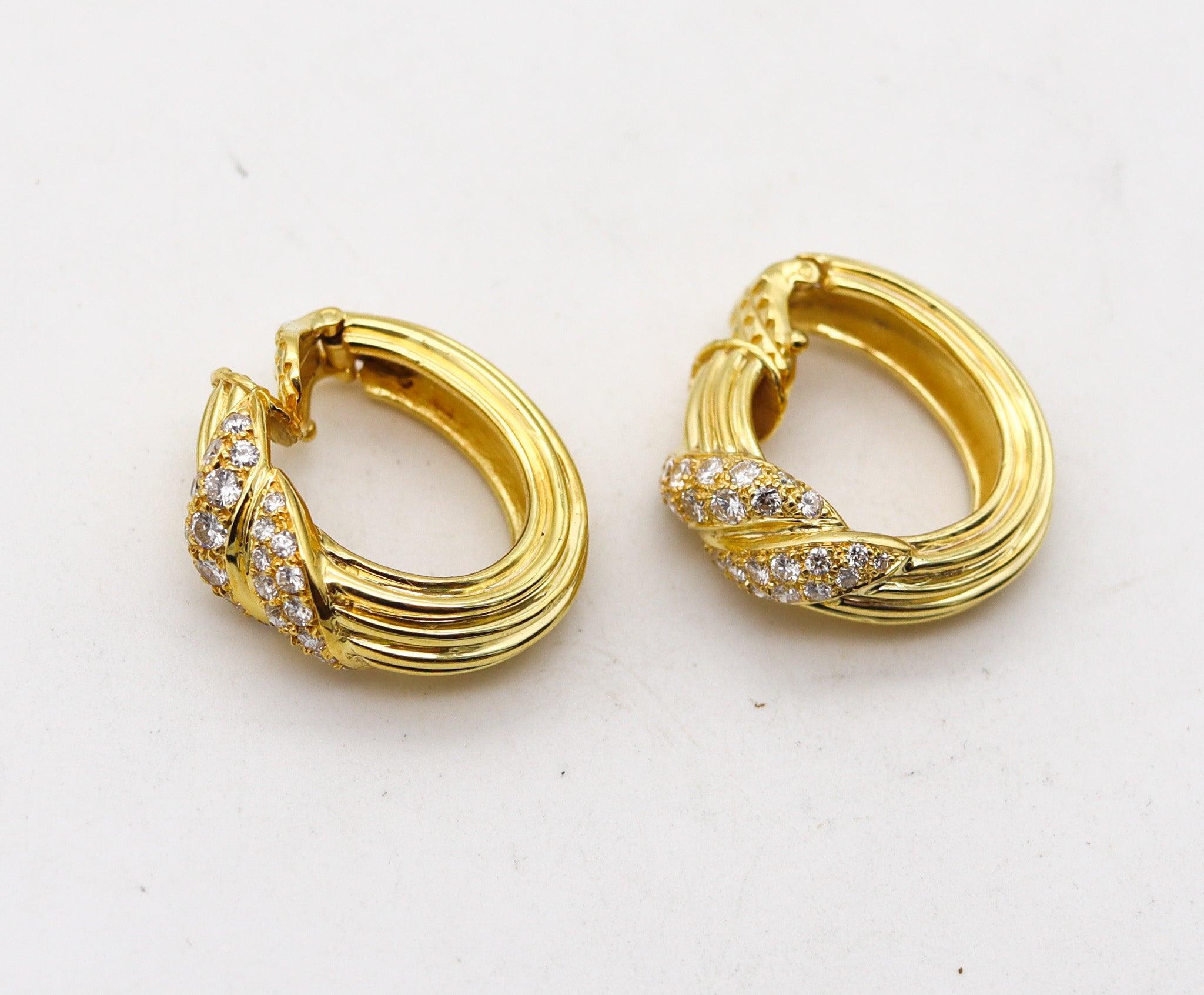 Clips-on hoop earrings designed by Fred of Paris.

Beautiful pair of hoop earrings, created in Paris France by the jewelry house of Fred Joaillier, back in the late 1970's. This gorgeous pair is a real statement, carefully crafted as a left and
