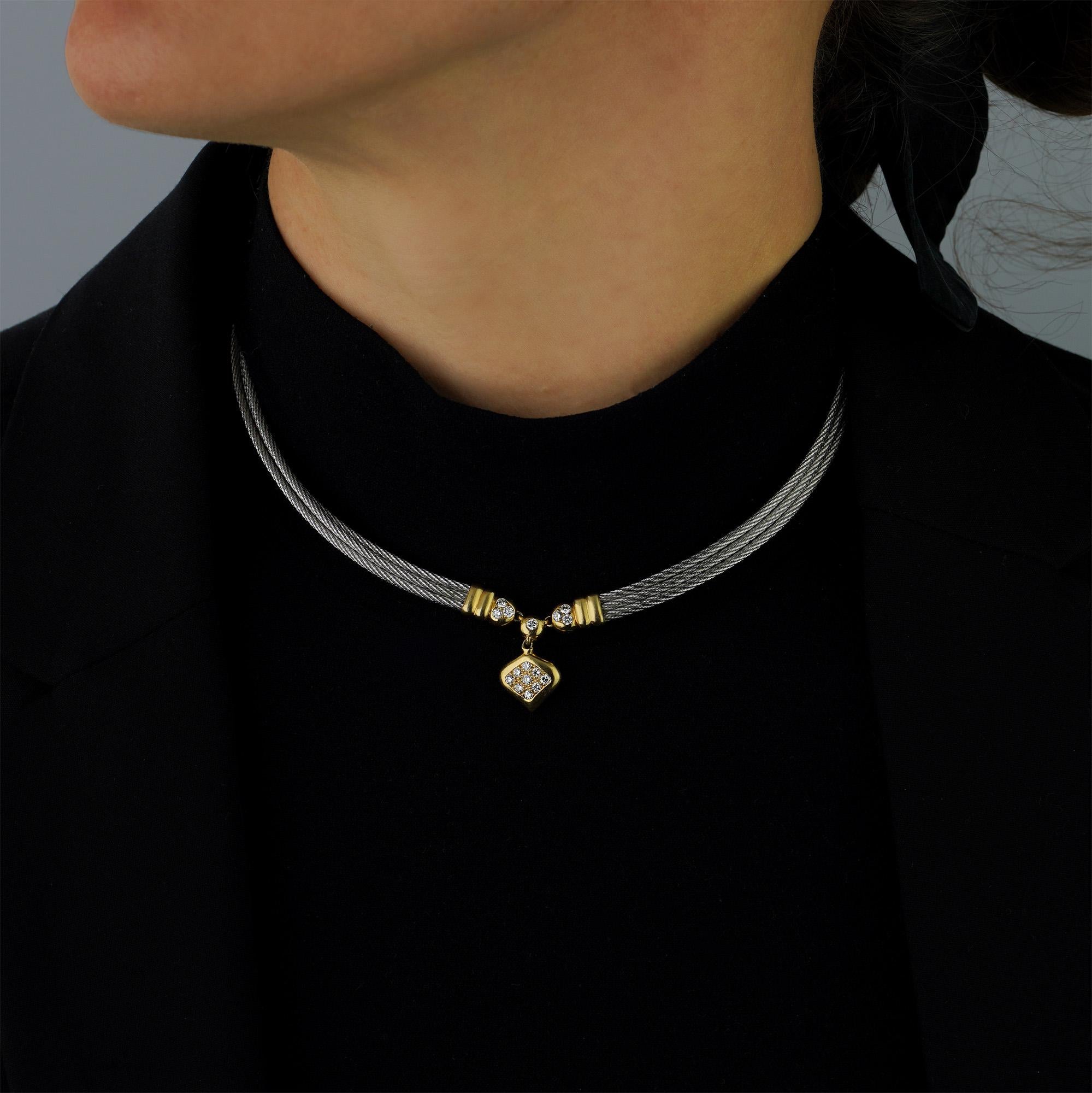 Fred Paris ladies 18kt. yellow gold and steel Force 10 necklace with heart pendant set with 0.80 ct. brilliant diamonds.
Designer: Fred Paris
Made in France Circa 2000's
Fully hallmarked.

Dimension - 
Approx. Length : 35 cm
Necklace Width : 0.6