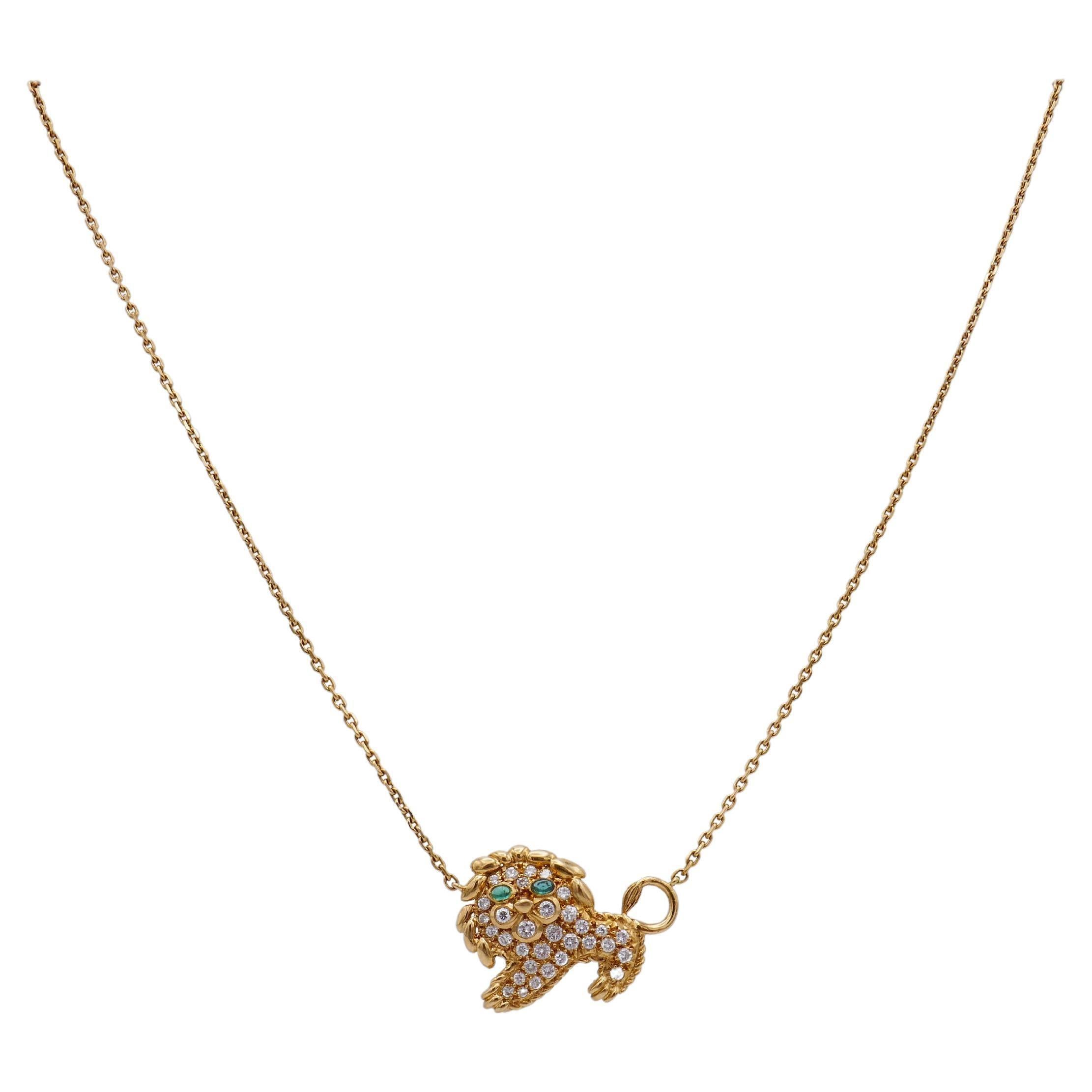 A delicate and cute gold Leo necklace by Fred Paris. 
Made of 18k yellow gold, the necklace features a lion pendant attached to a cable link chain. 
The pendant set with ~1.50 carats of pave and bezel set round brilliant diamonds, F-G color, VS