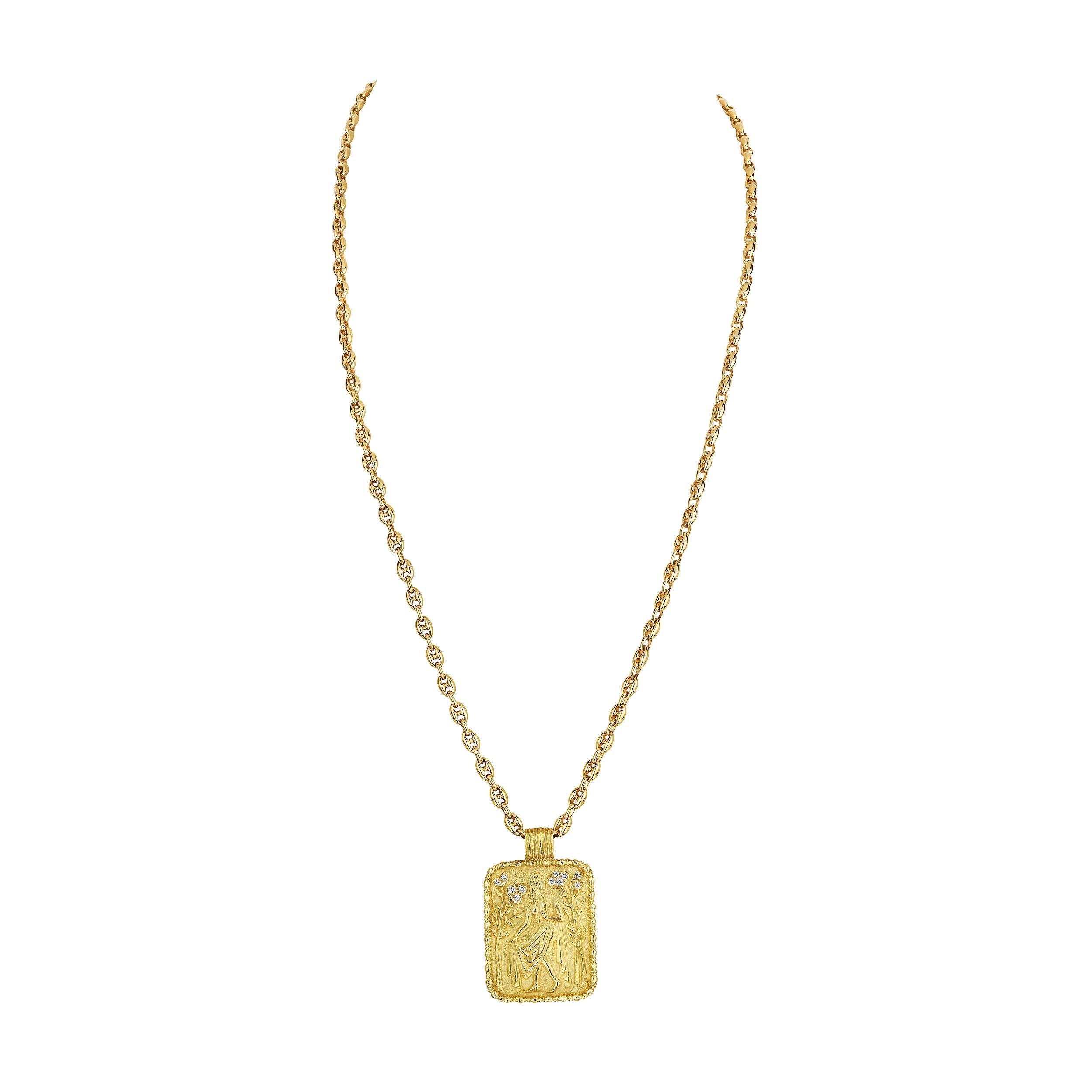 The zodiac earth symbol Virgo is a maiden and its attributed traits are incredible intellect and resourcefulness.  This Fred Paris Virgo diamond 18 karat yellow gold modernist pendant, with an engraved maiden and diamond garden front, will feature