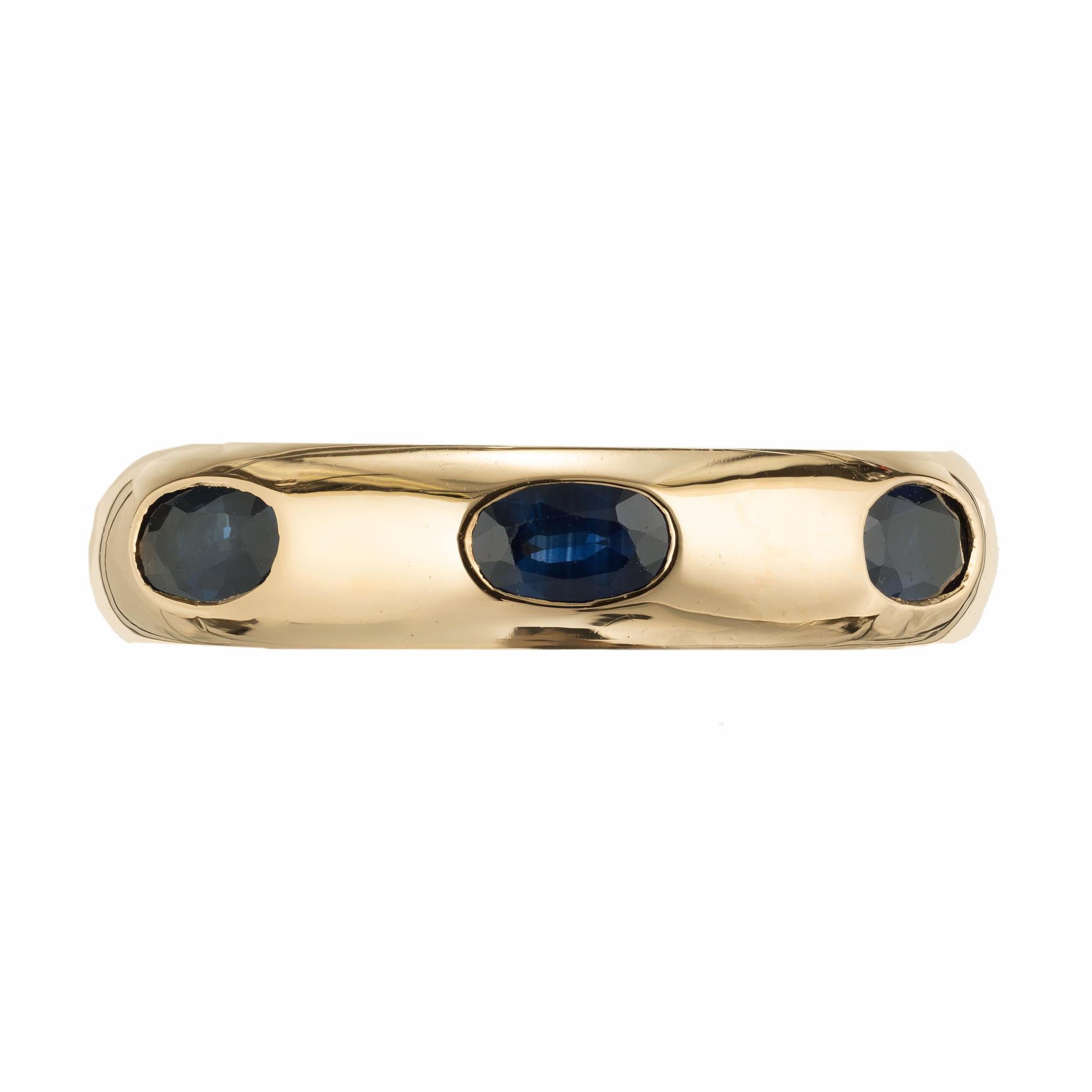 Fred the Jeweler Solid 18k yellow gold oval Sapphire band ring. 

7 oval genuine bright blue 5 x 3mm Sapphires, approx. total weight 2.45cts
Size 5 1/2 and limited sizing
18k Yellow Gold
Stamped: Fred 750 MA 96113
Width: 5.13mm
Depth: 3.03mm
9.6