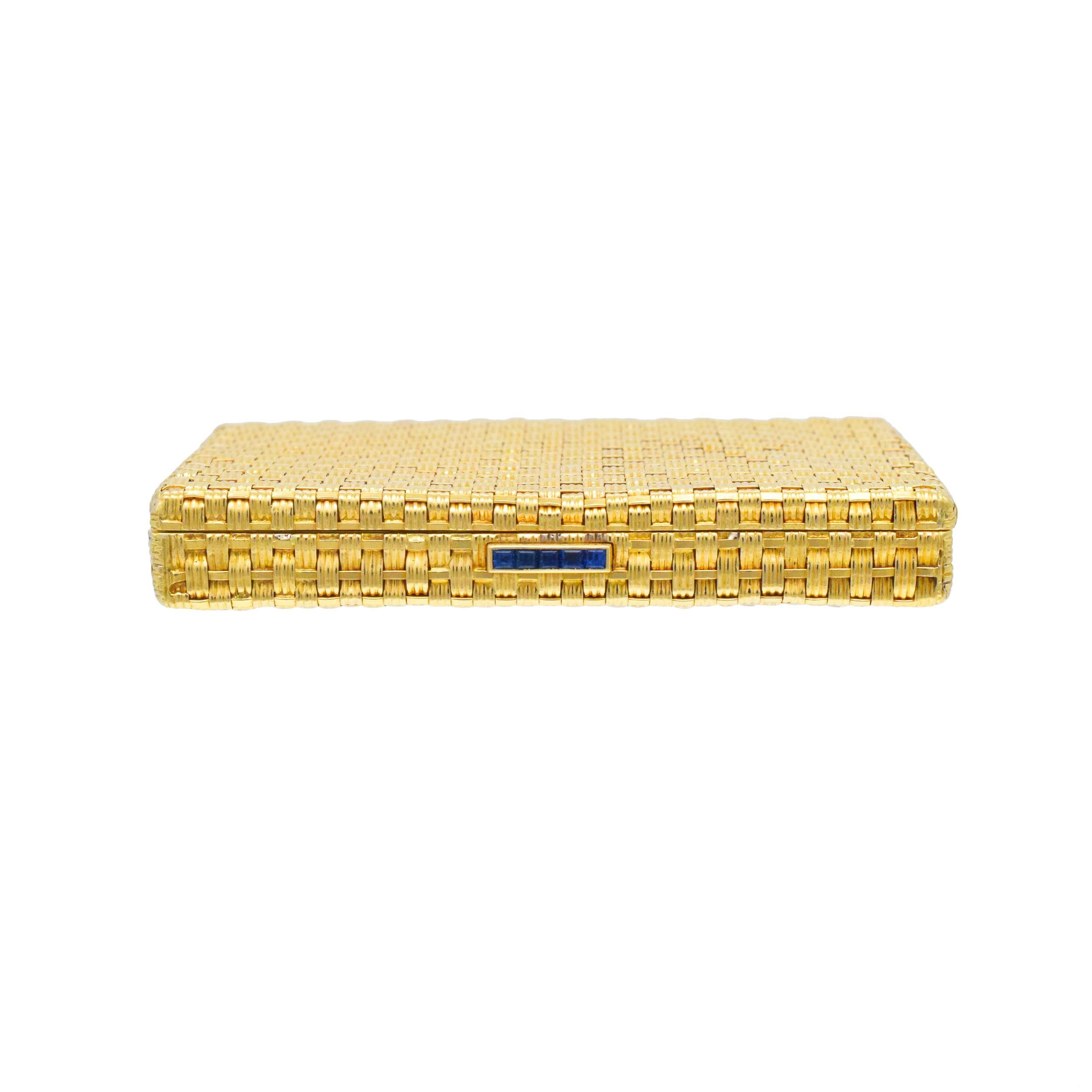Fred Woven 18k Yellow Gold Powder Case With Sapphire Thumb piece. There  are 5 square cut
sapphires with total weight of approximately 0.40ct.
Inside of the compact equipped with the powder tray and mirror. Stamped with Inscribed: Fred. Stamped with