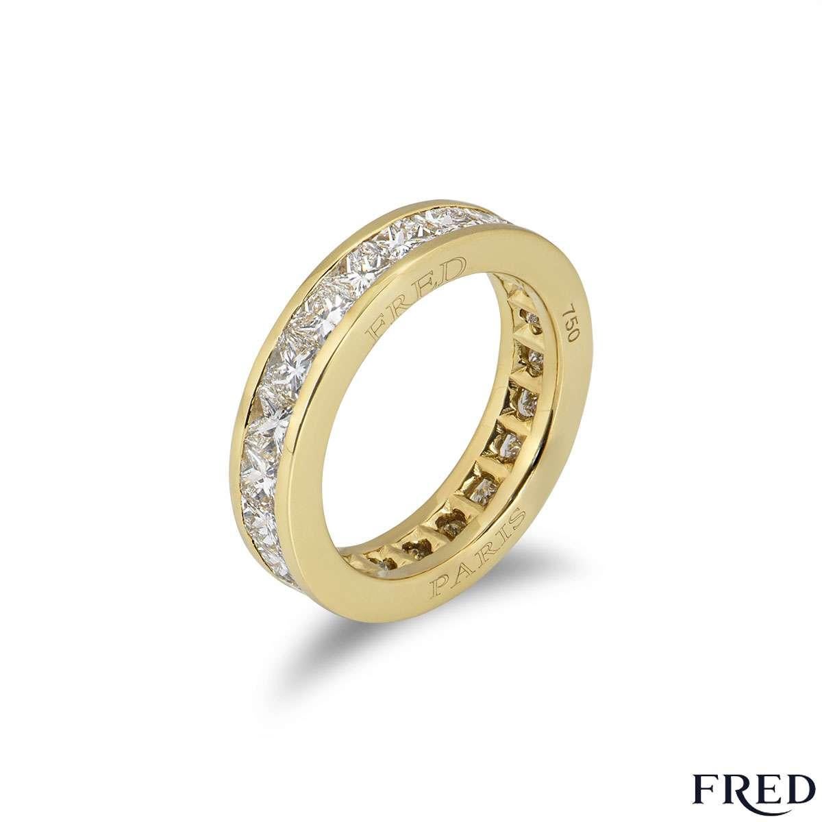 A beautiful 18k yellow gold Fred diamond eternity ring from the Bridal collection. The ring comprises of princess cut diamonds in a tension setting all the way around the ring. There are 22 diamonds with a total weight of approximately 2.20ct. The
