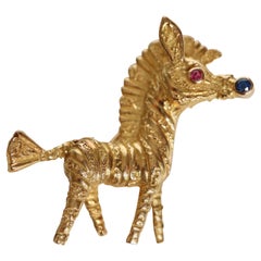 Fred Zebra Brooch in 18 Carat Yellow Gold Ruby ​​and Sapphire