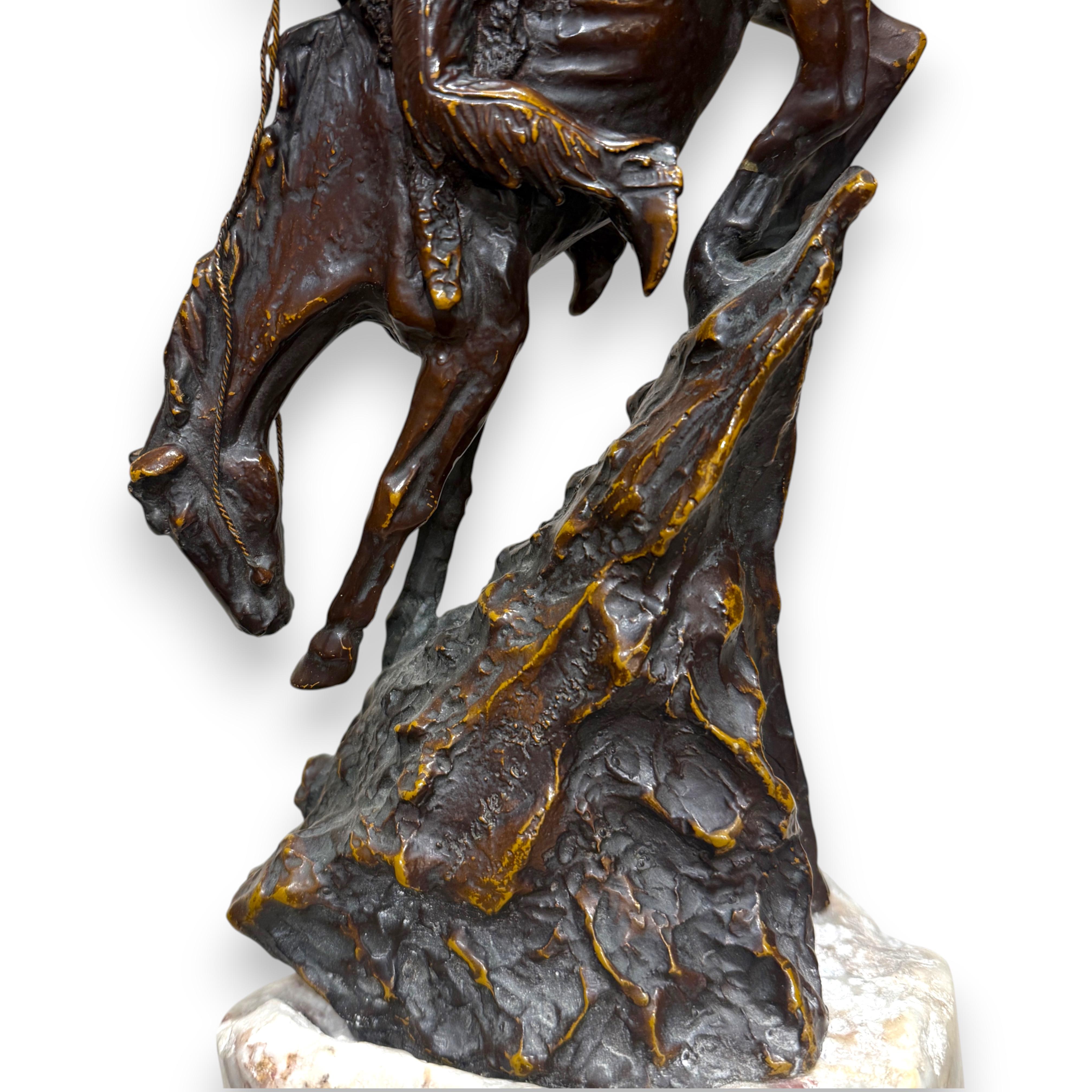 This striking bronze sculpture, attributed to the legendary American artist Frederic Remington, captures the essence of the rugged frontier spirit with breathtaking motion and anatomical precision. Titled “The Mountain Man,” the piece depicts a