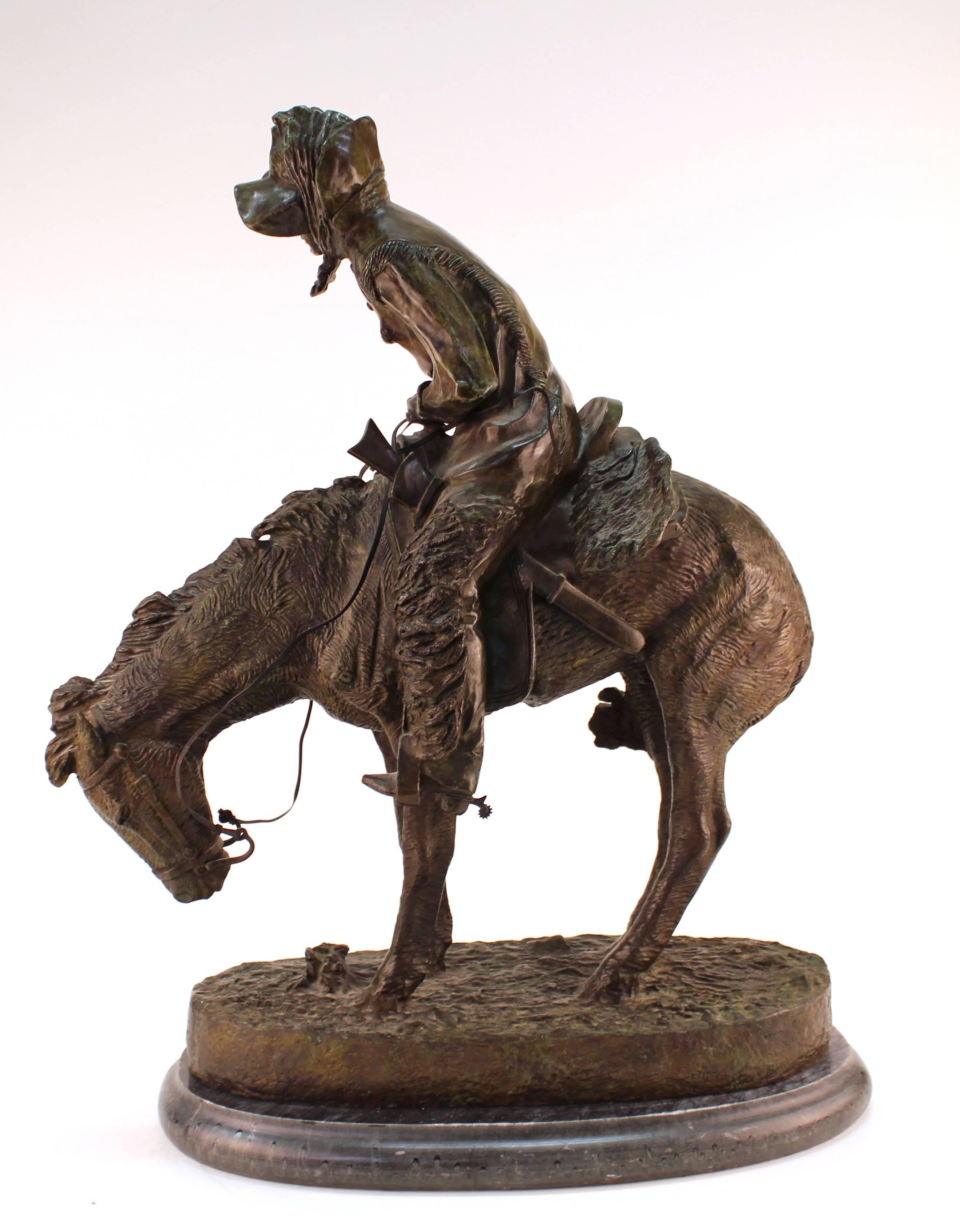 A detailed bronze sculpture by Frederic Remington, titled 