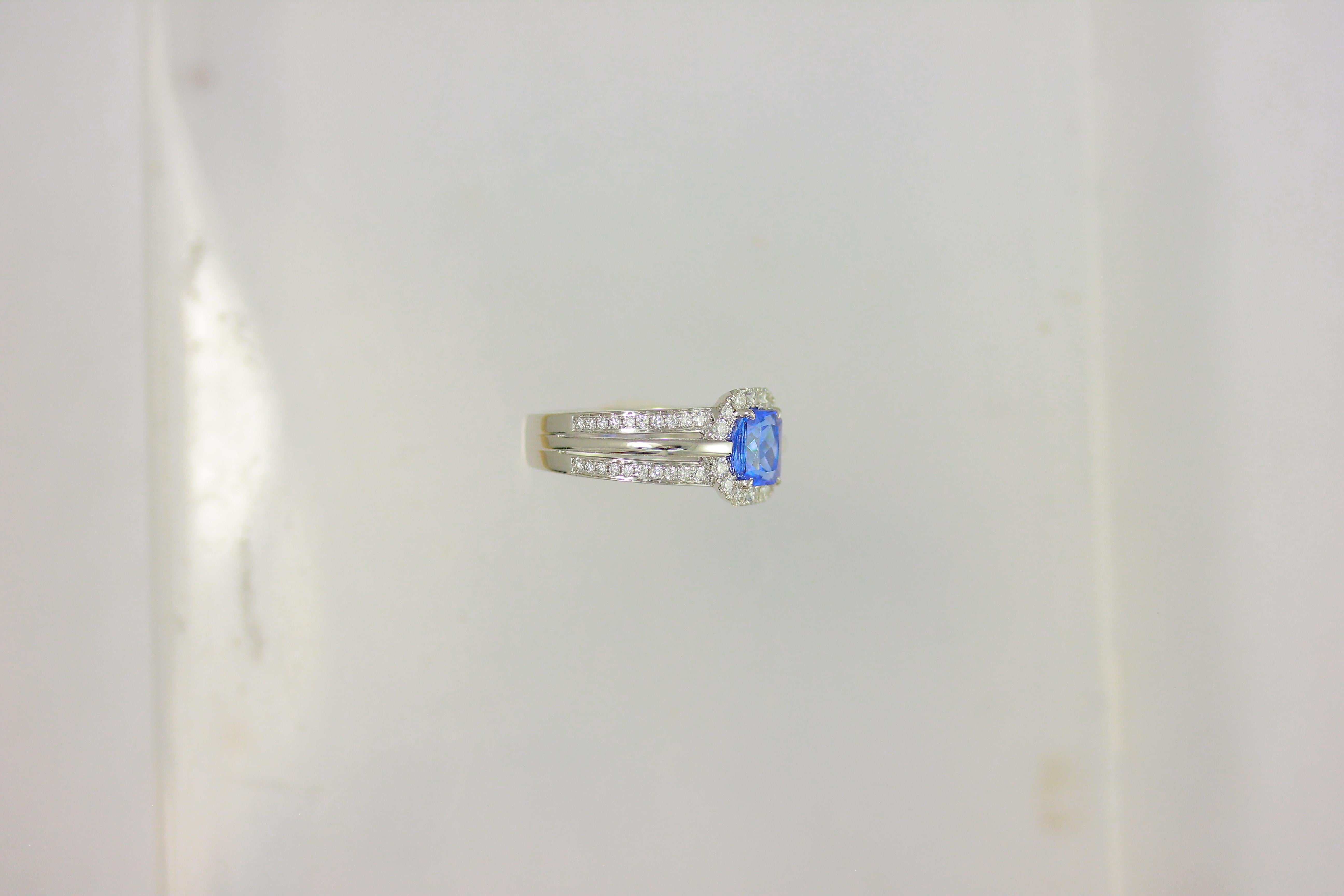 14K White Gold Tanzanite Center White Diamond Outside and Polished Inside Reverse Eclipse One of Kind Bridal Engagement Cocktail Ring

Center Tanzanite weight: 1.35 ct
Total diamond count: 54
Total diamond weight: 0.49 CT
