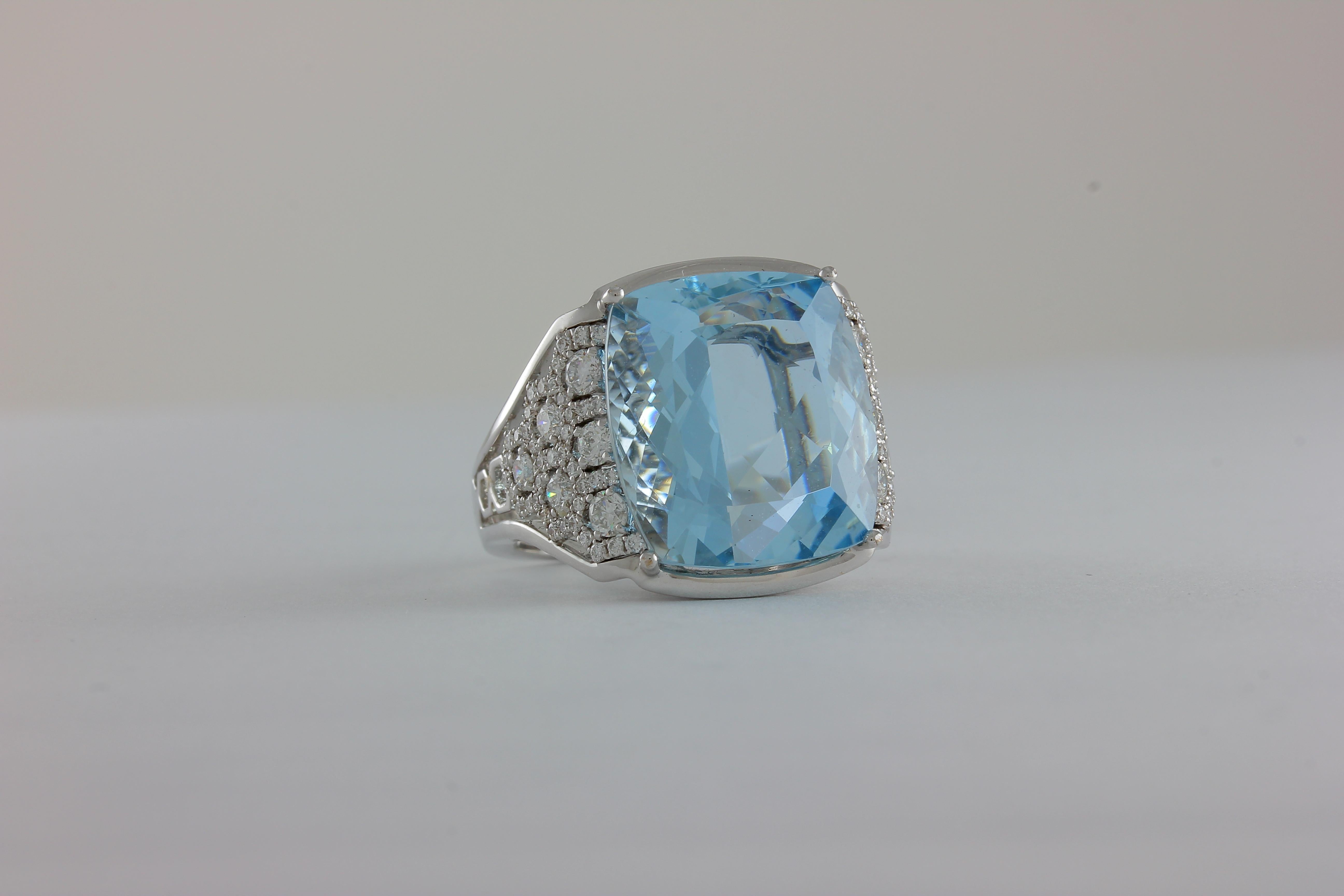One-of-a-kind Frederic Sage cushion-shaped Aquamarine ring with graduating microset diamond cluster accents set in 18 karat white gold

Total Aquamarine weight: 14.17 ct
Total diamond count: 92
Total diamond weight: 0.90 ct
Finger size: 7