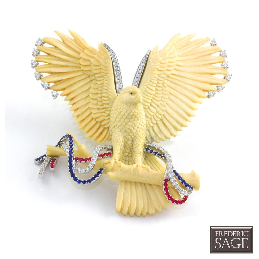 18K WG BONE EAGLE PENDANT/PIN WITH DIAMONDS, BLUE SAPPHIRE AND RUBIES
BONE 56.63 CTS, 81 DIA 1.10 CTS, 40 BS 0.51 CT, 22 RUBY 0.33 Carats
