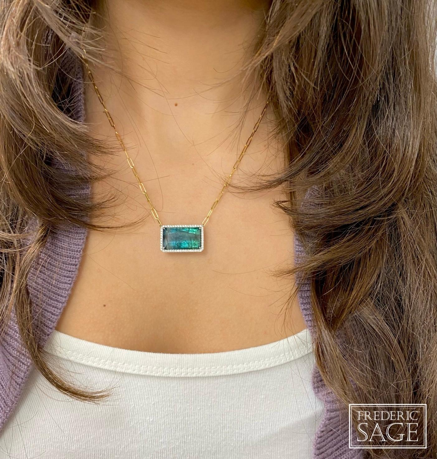 18K Yellow & White Gold Bi-color Blue Green Tourmaline Set Horizontally In a White Gold Diamond Mounting With Attatched Yellow Gold Paperclip Chain, TOUR 15.04 CT. 52 DIA 0.37 CT, approx 22.5 mm x 25 mm

Available in other metal/ gemstone options: