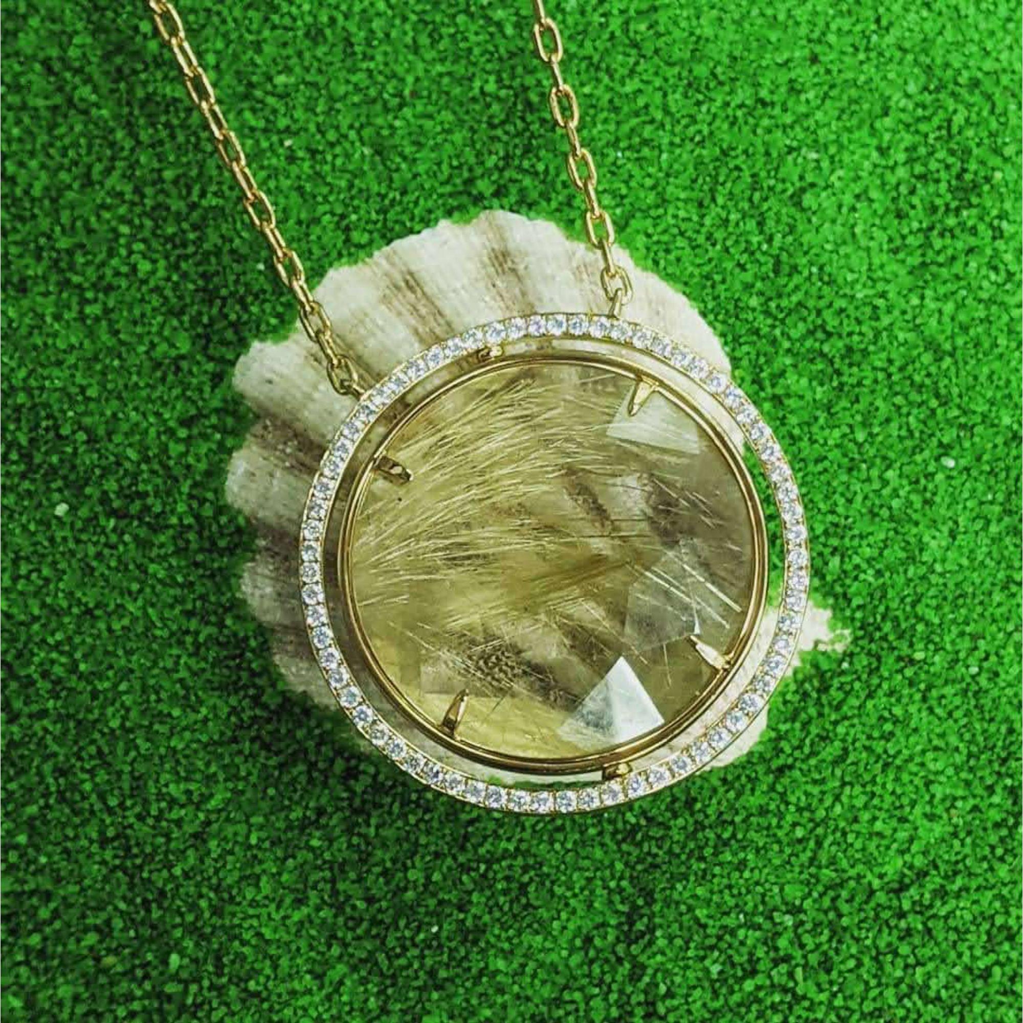 Round Rutilated Quartz Medallion Pendant With Chain, Diamond 1.05 Ct, Rutilated Quartz 46.48 Ct, Approximately 38.5 mm diameter

Available in other metal/ gemstone options: These Gemstone pieces can be made in white, pink, yellow gold or two-tone.