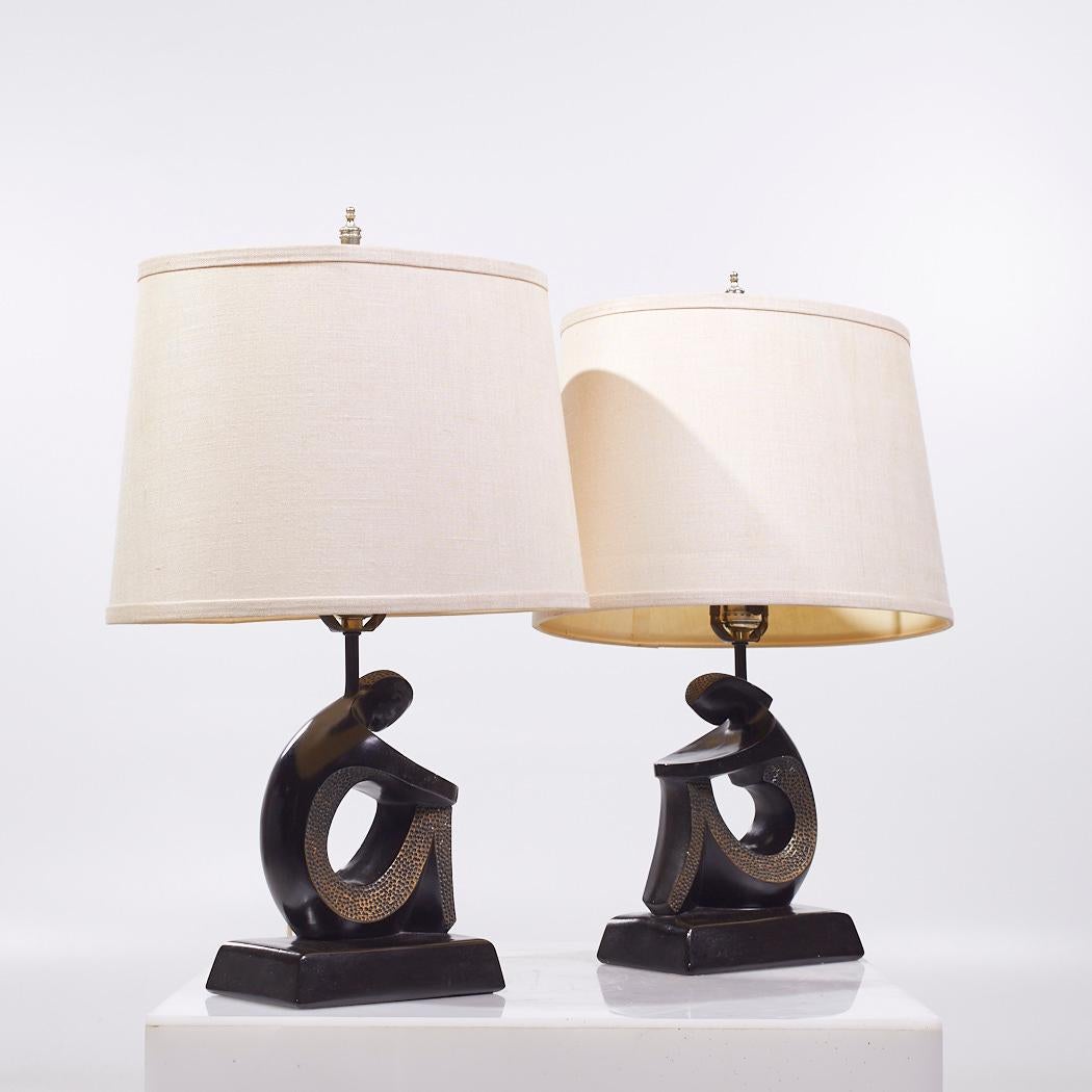 Frederic Weinberg Style F.A.I.P. Mid Century Figurative Table Lamps - Pair

Each lamp measures: 16 wide x 11 deep x 22 inches high

We take our photos in a controlled lighting studio to show as much detail as possible. We do not photoshop out