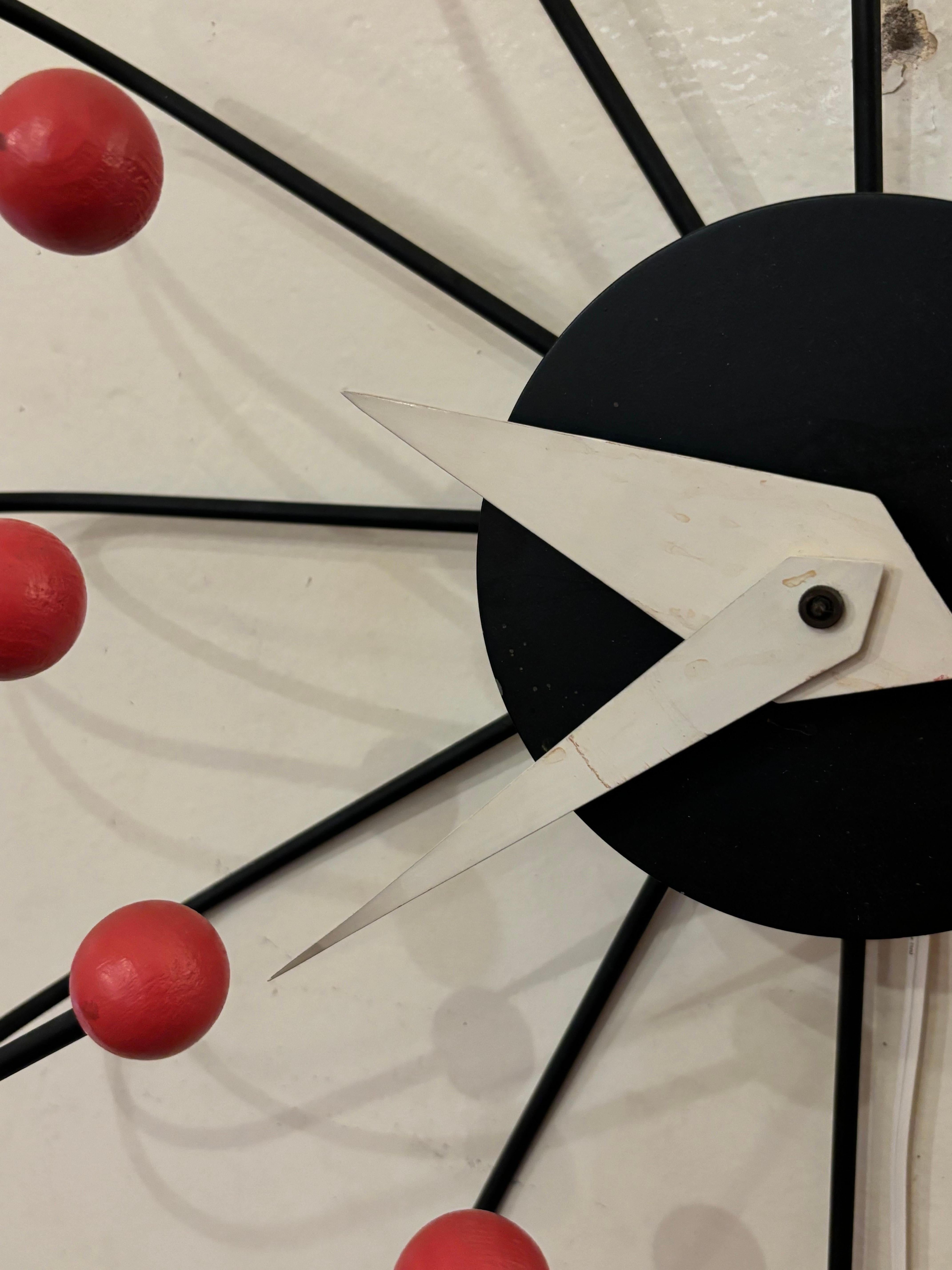 Frederic Weinberg Wall Clock with Black Body and Arms and Coral Balls.  Working Condition.  This is the larger harder to find version of this classic Clock!  Clock measures 23.25