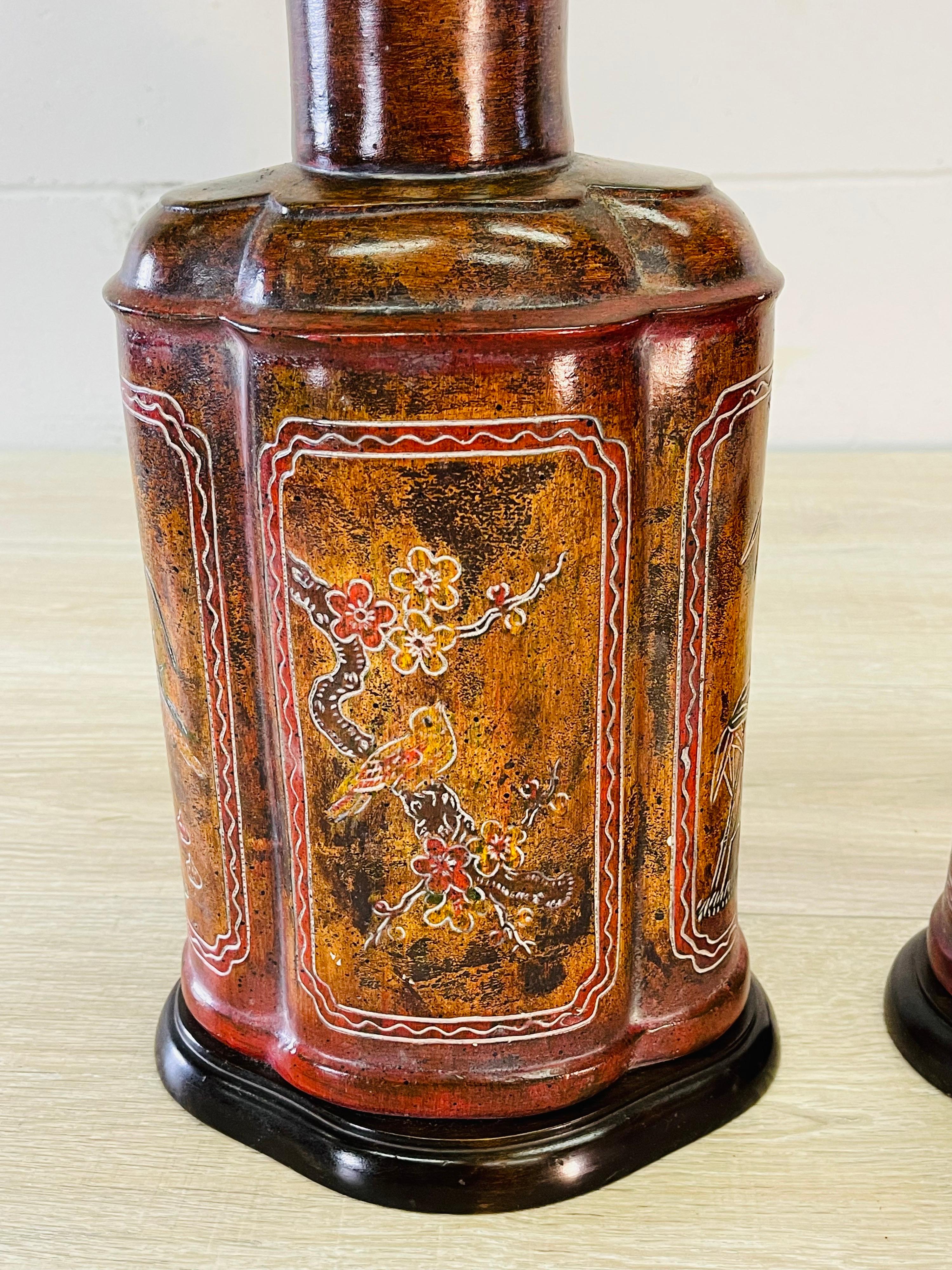 Vintage 1970s pair of Frederick Cooper Asian-style table lamps. The lamps have an urn style design with Asian scences on both sides. Wired for the US and in working condition. Socket, 20” H. Harp, 4”diameter x 7” height. Lamps use a standard 3-way