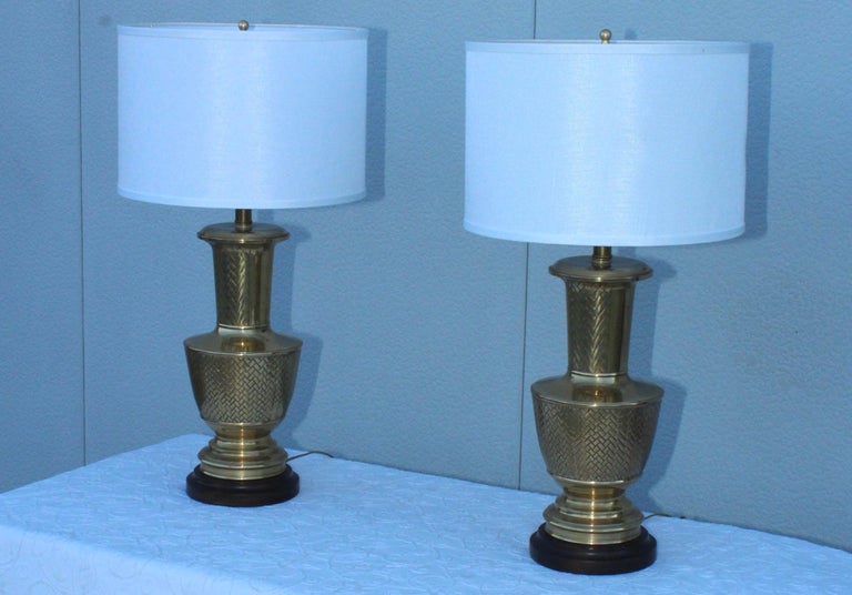 1980s Mid-Century Modern brass table lamps with wood base by Frederick Cooper.

Shades for photography only.