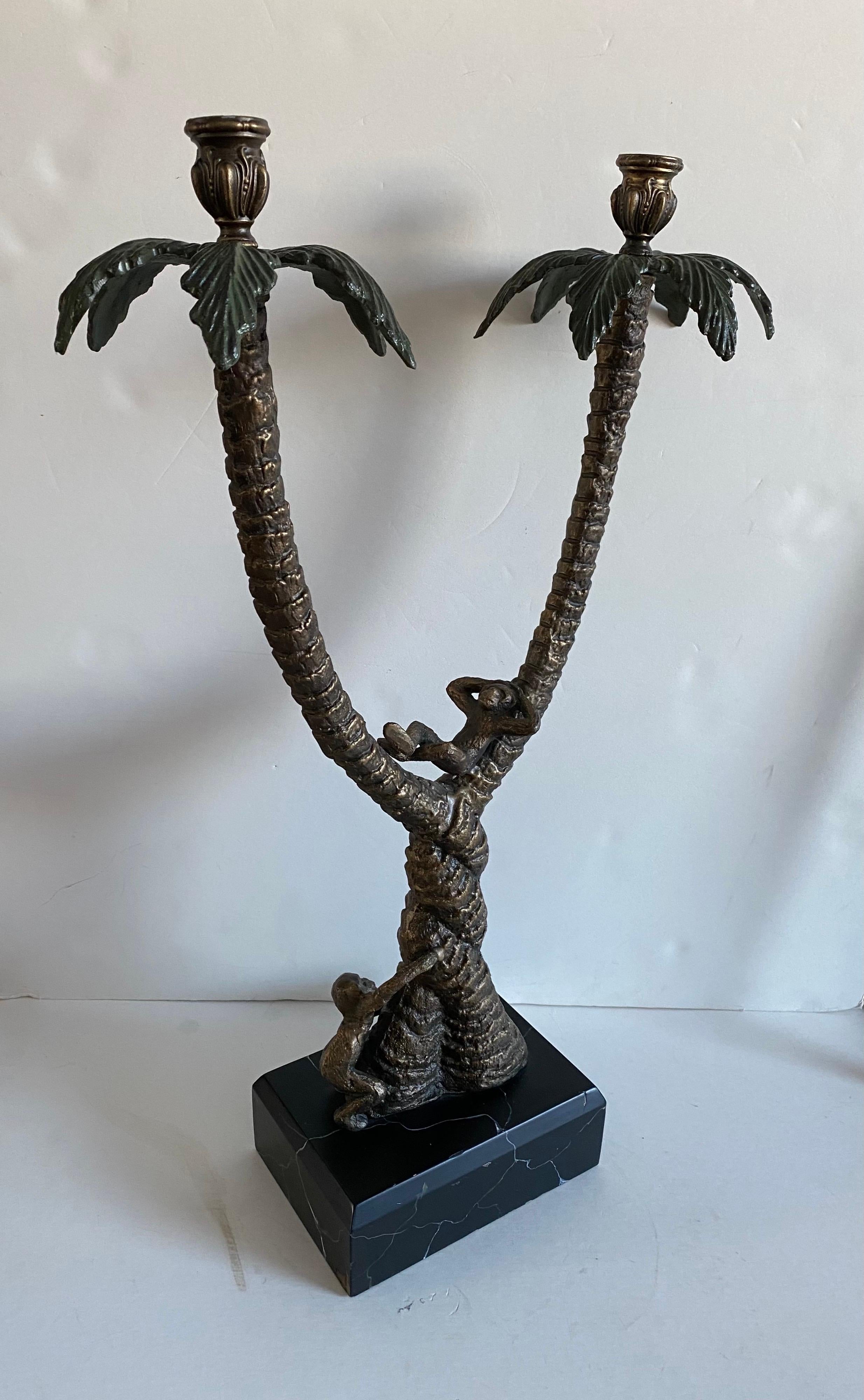 An exquisite Frederick Cooper “Safari Collection” bronze monkey candelabra / candle holder.

Features two arms and a faux marbleized black wood base.

This fine example is made from bronze with meticulous detail, with a pair of monkeys playfully