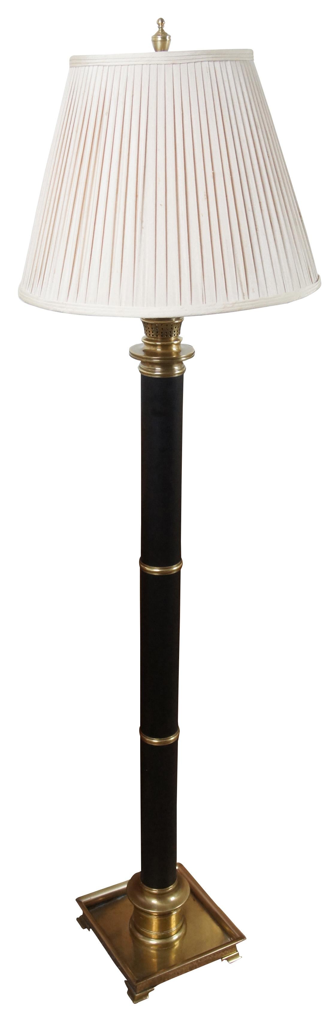 Vintage Frederick Cooper floor lamp with a square brass base supporting a black body and oil lamp style top. This gorgeous lamp drawer inspiration from iconic French Empire and Regency lighting.
   
9” x 9” x 51” / Shade - 18.5” x 12.5” / Height