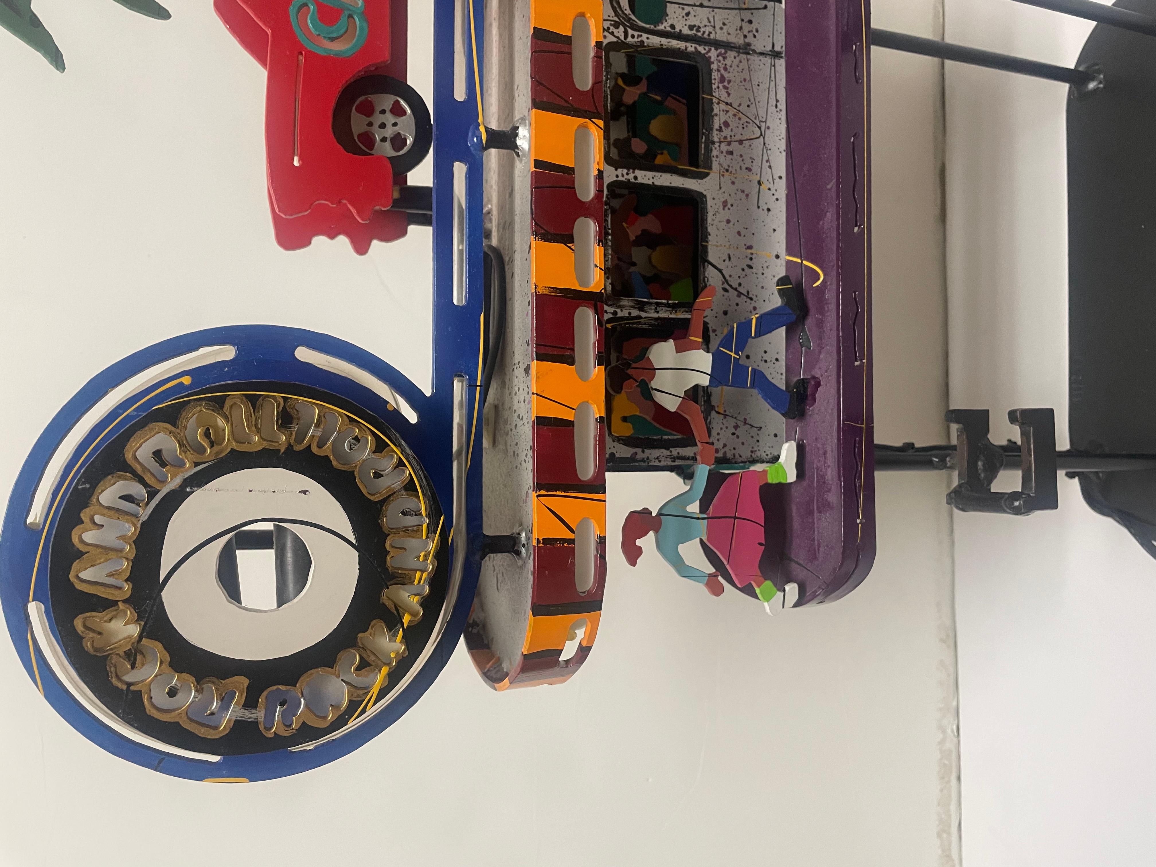This is an Frederick Prescott sculpture signed and numbered “Rocking Roll Cafe”. Comes with stand 2 piece set. Piece also lights up. Really cool.