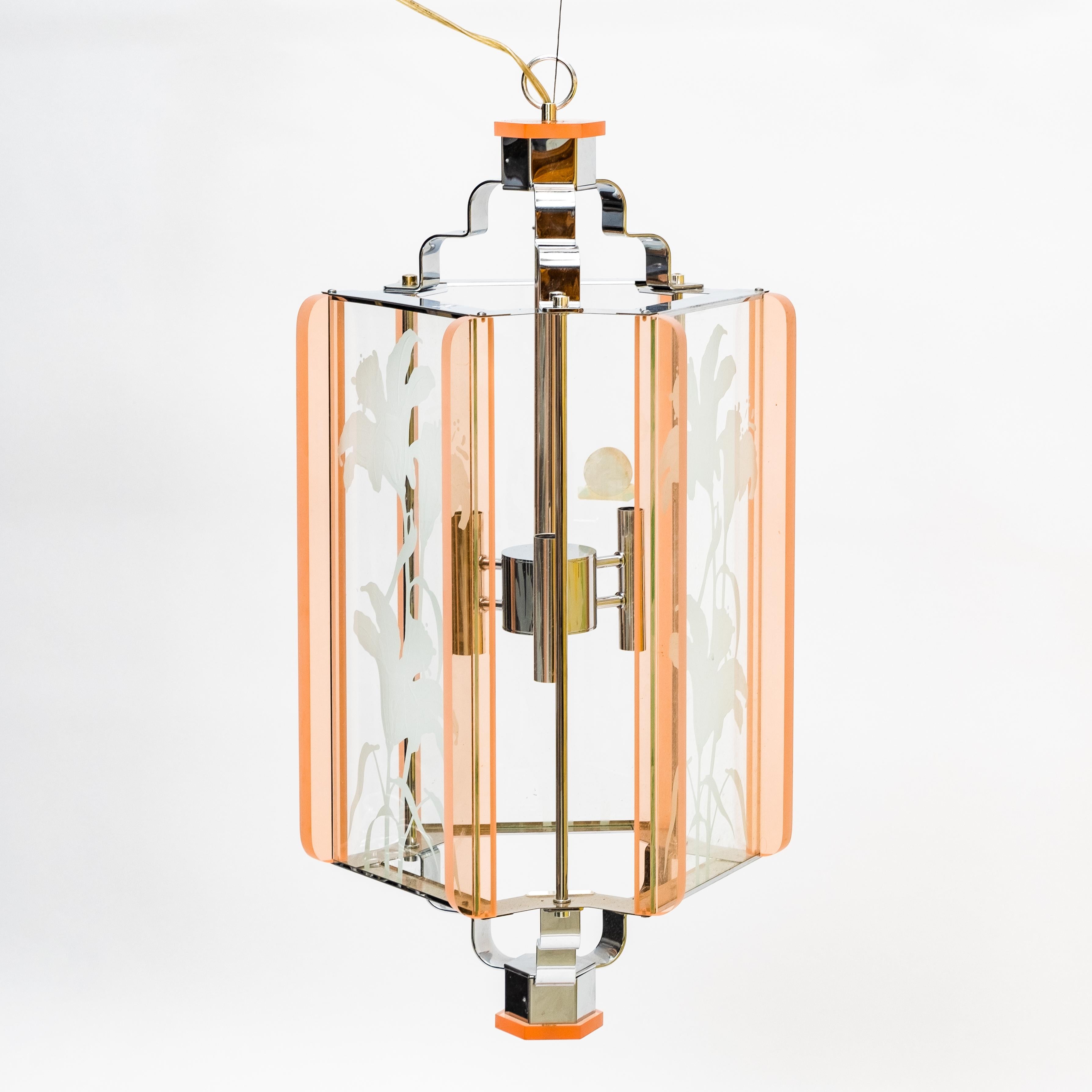 Frederick Ramond signed chandelier, 20th century modern, designed 1987, hexagonal lantern with three glass panels decorated with frosted glass floral sprays, framed by pink glass and set in chrome frame, three candelabra sockets, fixture, stamped