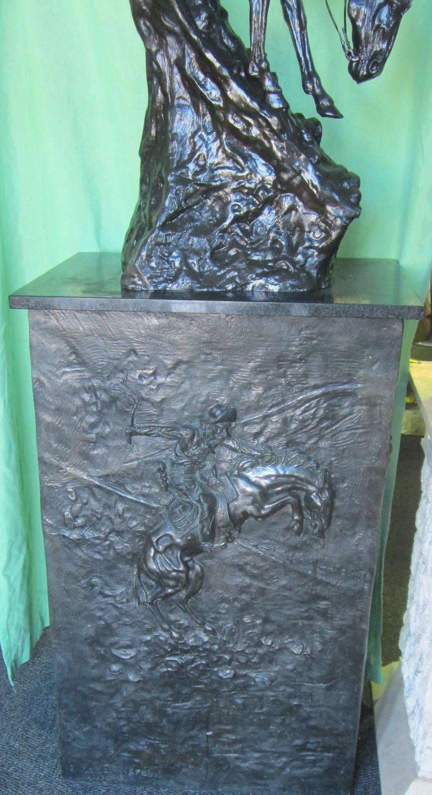 Mountian man, Signed Frederick Remington replica bronze on a black marble base, on a large embossed bronze plinth, Figure 60 x 33 x 98 cm high,
Base 59 x 40 x 93 cm high,
Total height 191 cm.