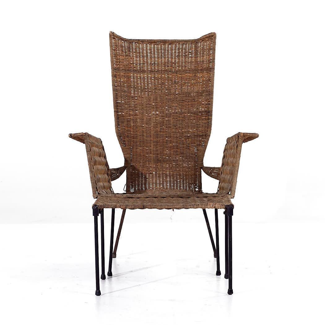 Frederick Weinberg Style Mid Century Wicker and Wrought Iron Chair and Ottoman

The chair measures: 28.5 wide x 23 deep x 37.5 high, with a seat height of 12.5 inches and arm height/chair clearance of 21.5 inches
The ottoman measures: 19 wide x 14