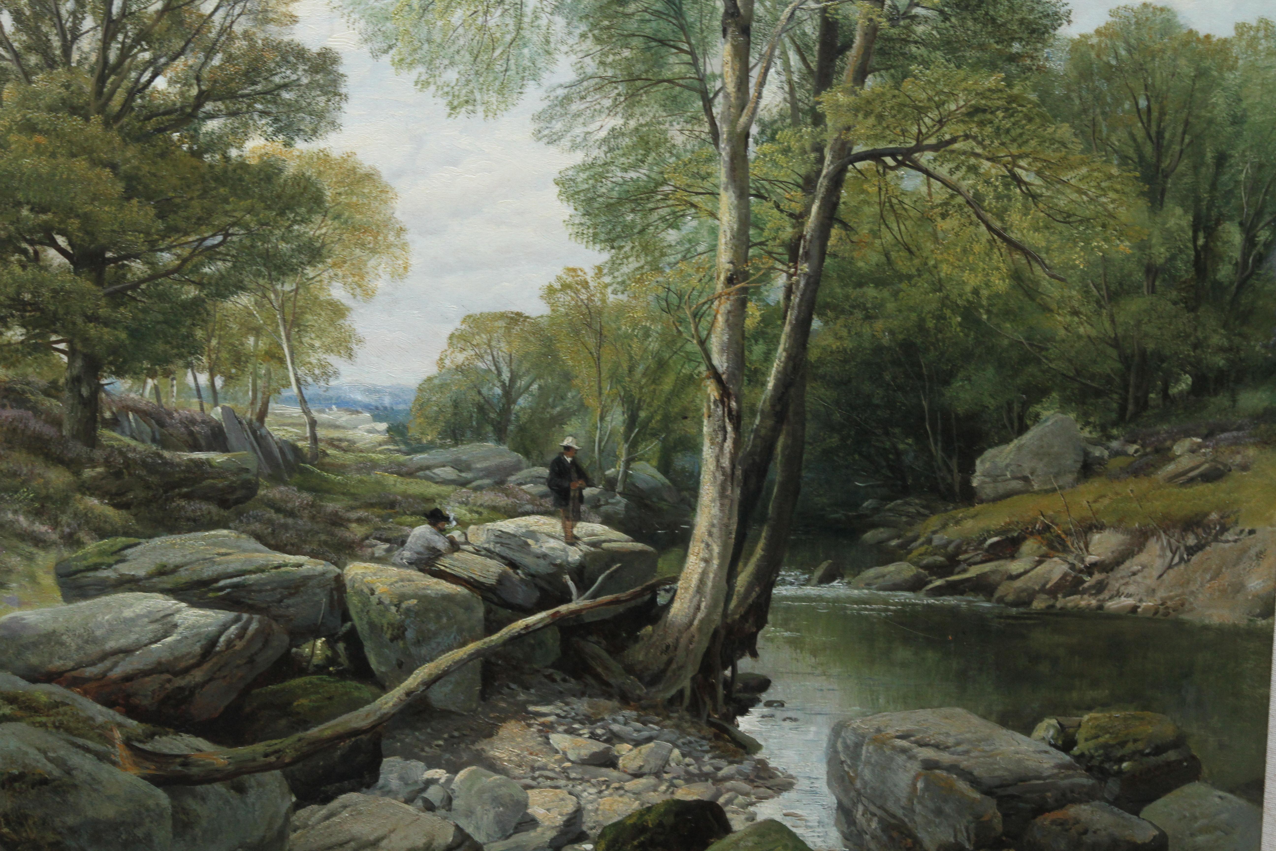 This charming Victorian landscape is by much exhibited British artist Frederick William Hulme. The painting is of two fishermen on large rocks by the edge of a river. They are stood under a tree with a landscape view in the background and a summer's