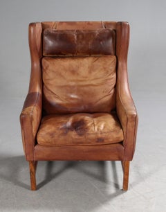 Silla con respaldo Frederik A. Kayser tapizada en piel color coñac