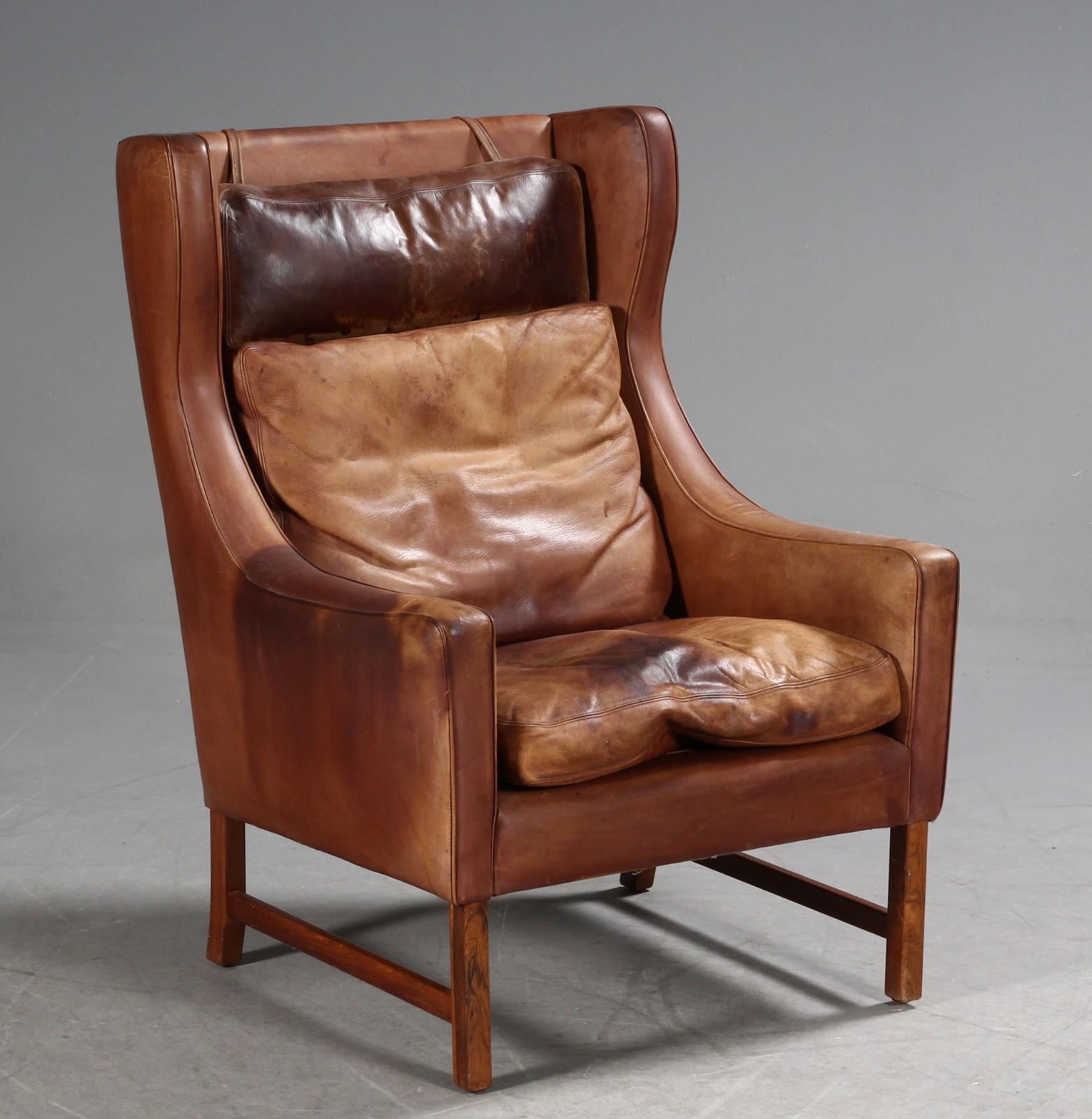 Scandinavian Modern Frederik A. Kayser Wingback Chair Upholstered in Cognac-Ccolored Leather For Sale