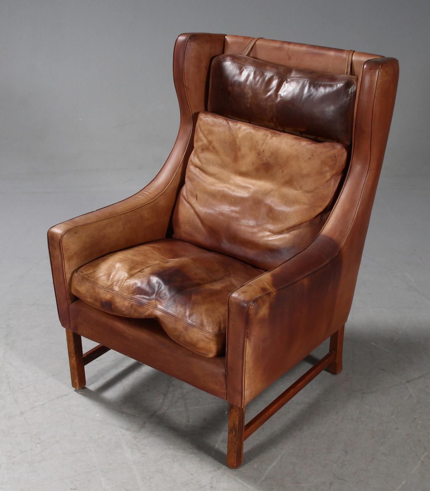 Norwegian Frederik A. Kayser Wingback Chair Upholstered in Cognac-Ccolored Leather For Sale