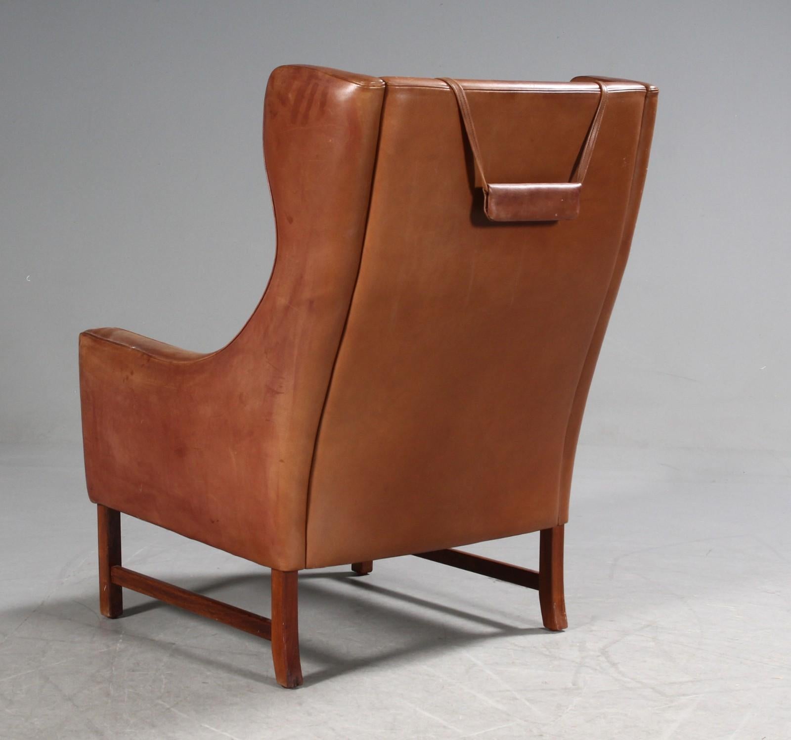 Frederik A. Kayser Wingback Chair Upholstered in Cognac-Ccolored Leather In Fair Condition For Sale In Vienna, AT