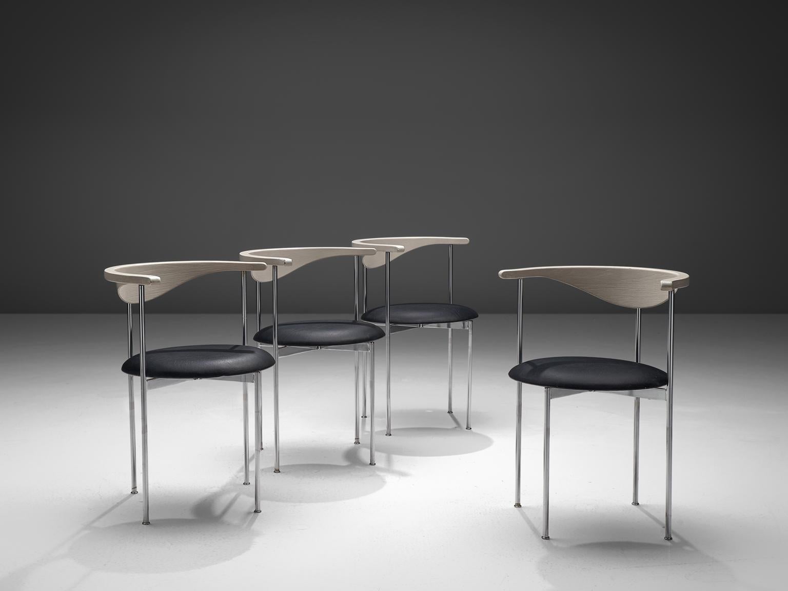 Frederik Sieck, four chairs, black skai, metal, lacquered wood, Denmark, design 1962, execution 1967.

These industrial clear set of the model 3200 chairs were designed by the Swedish Frederik Sieck for Fritz Hansen. The round chair has a Classic