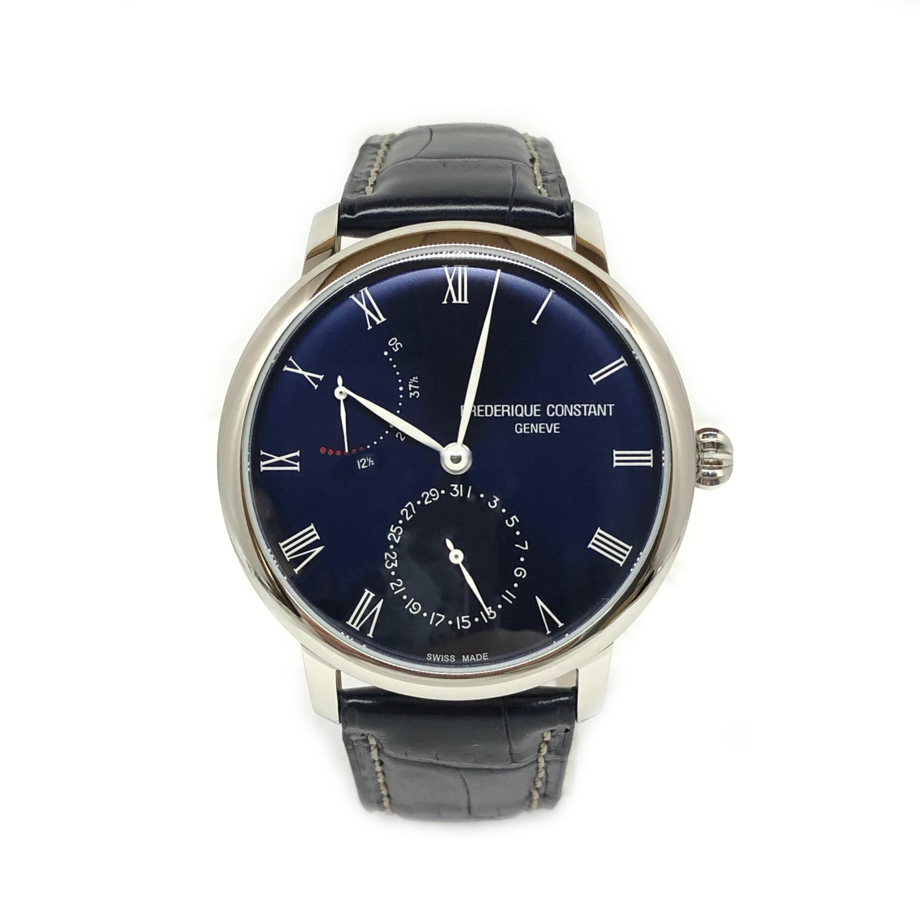 This Men’s watch has a 40 mm round stainless steel case with fixed bezel. Dark blue dial with and silver-tone leaf-style shape hands & Roman numerals hour markers. The date display at 6 o’clock and the power reserve indicator at 10 o’clock position.
