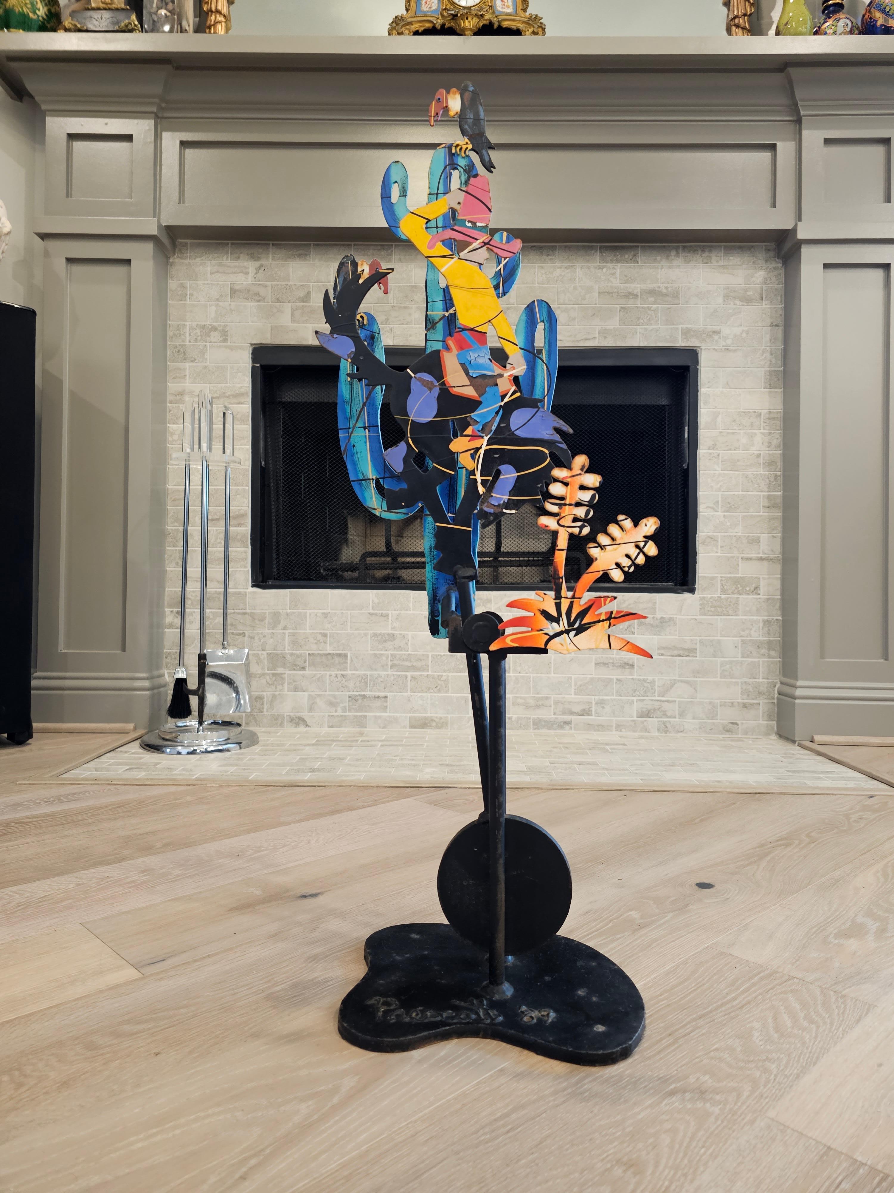 A large vintage Fredrick Prescott (American, b.1949) cowboy Kinetic sculpture. 

The rare hand painted iron Kinetic sculpture, titled Bucking Bronco, features a reversible swinging pendulum-like rod topped with a cowboy riding a horse, with a