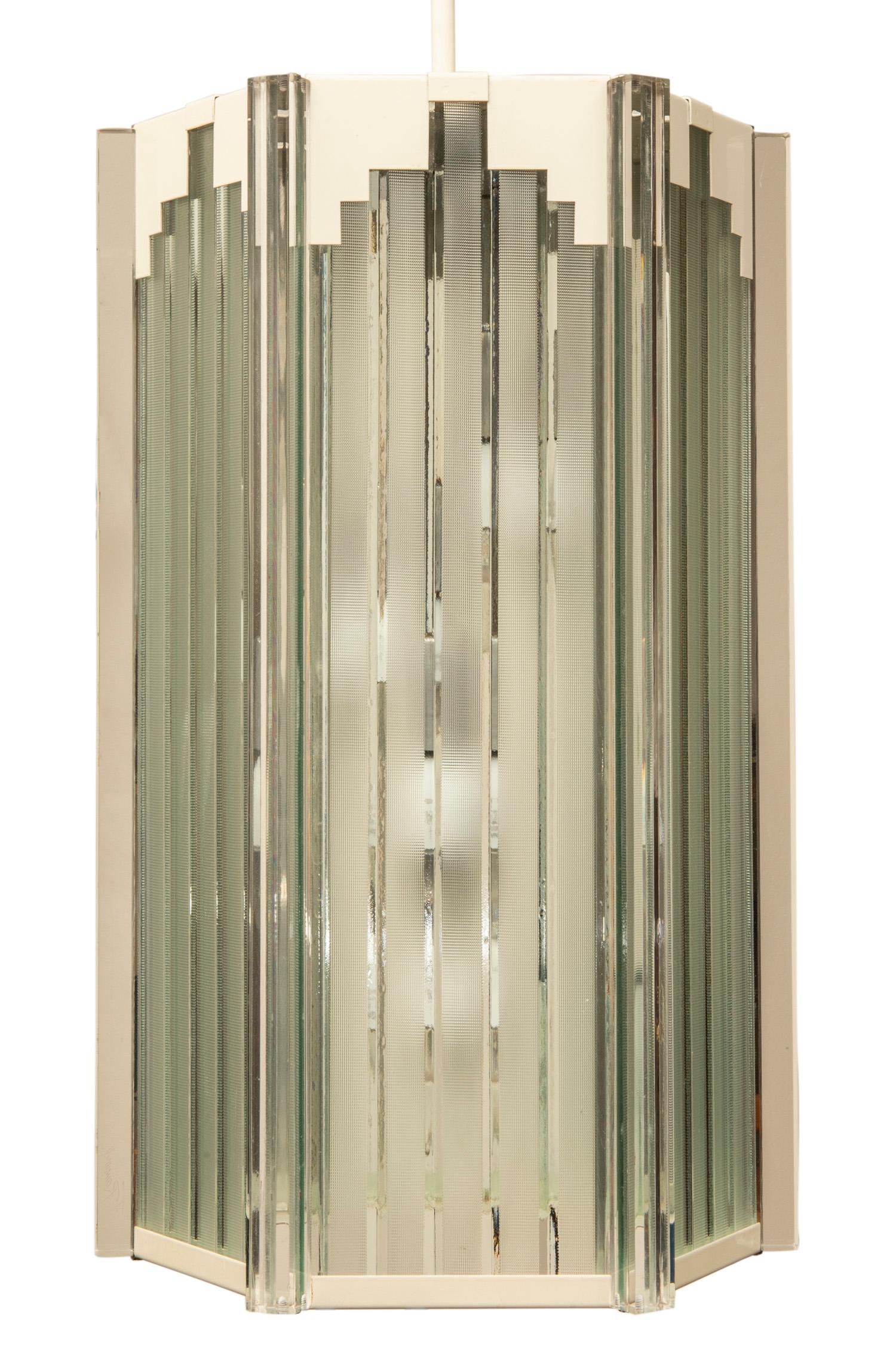 This Art Deco inspired four light pendant in white with acrylic etched window panels is
mounted with a center poll that can be cut to suit your height restrictions. It bears its 
original Frederick Raymond label dated 1985.