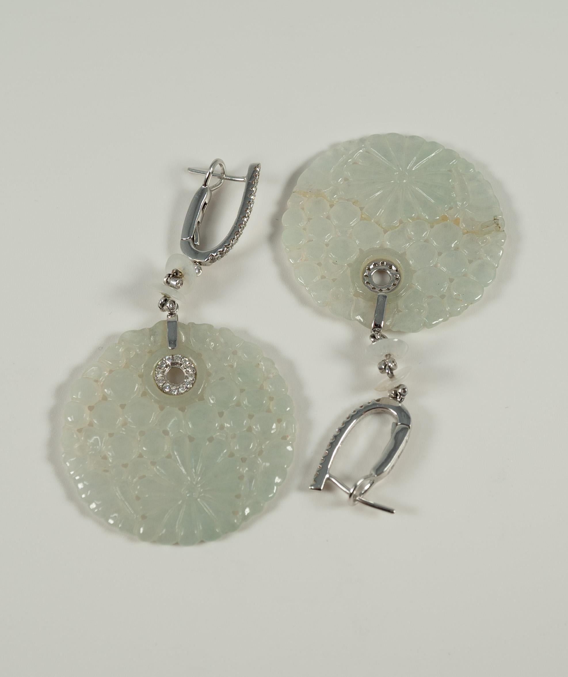 Just so lovely!  By designer Fredrick Sage, these jade and diamond earrings are a beautiful addition to any collection!  

The jade portion weighs 7.22 grams and the diamonds are stated to have a total weight of 0.39 cts.