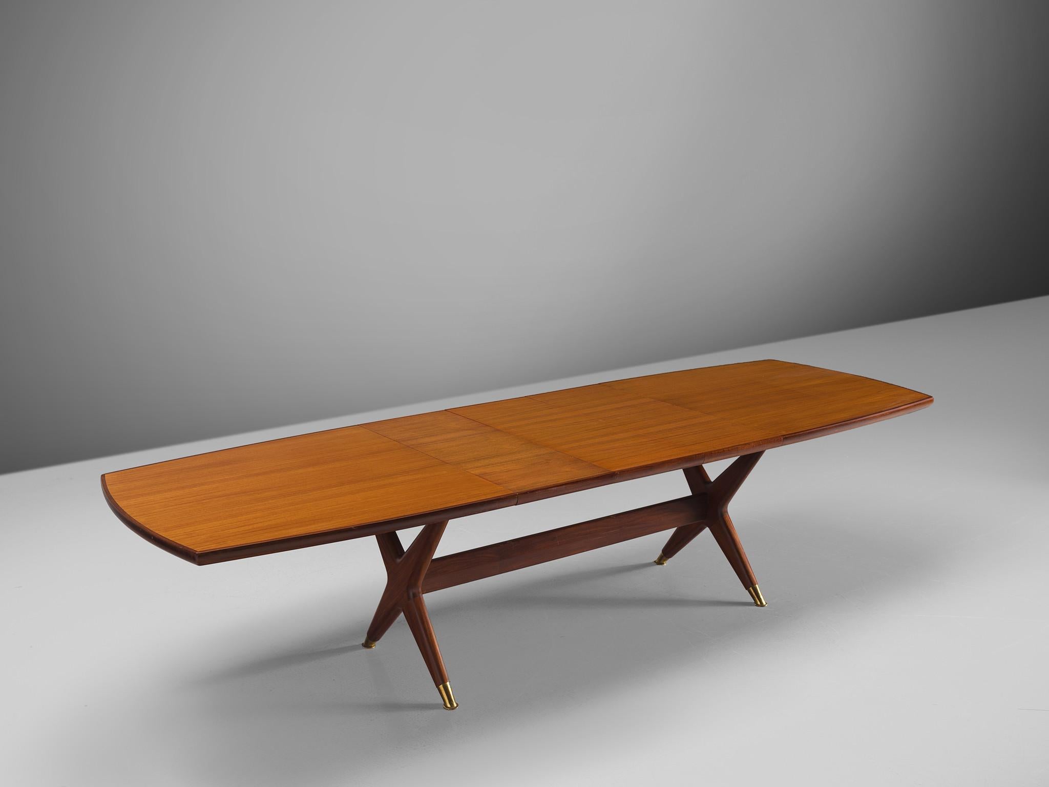 Fredrik Kayser for Gustav Bahus of Norway, table, teak, mahogany and brass, Norway, 1960s. 

This table goes by the name 'Captain'. The table features a quintessential Danish design with soft lines and natural, honest materials. The top is executed