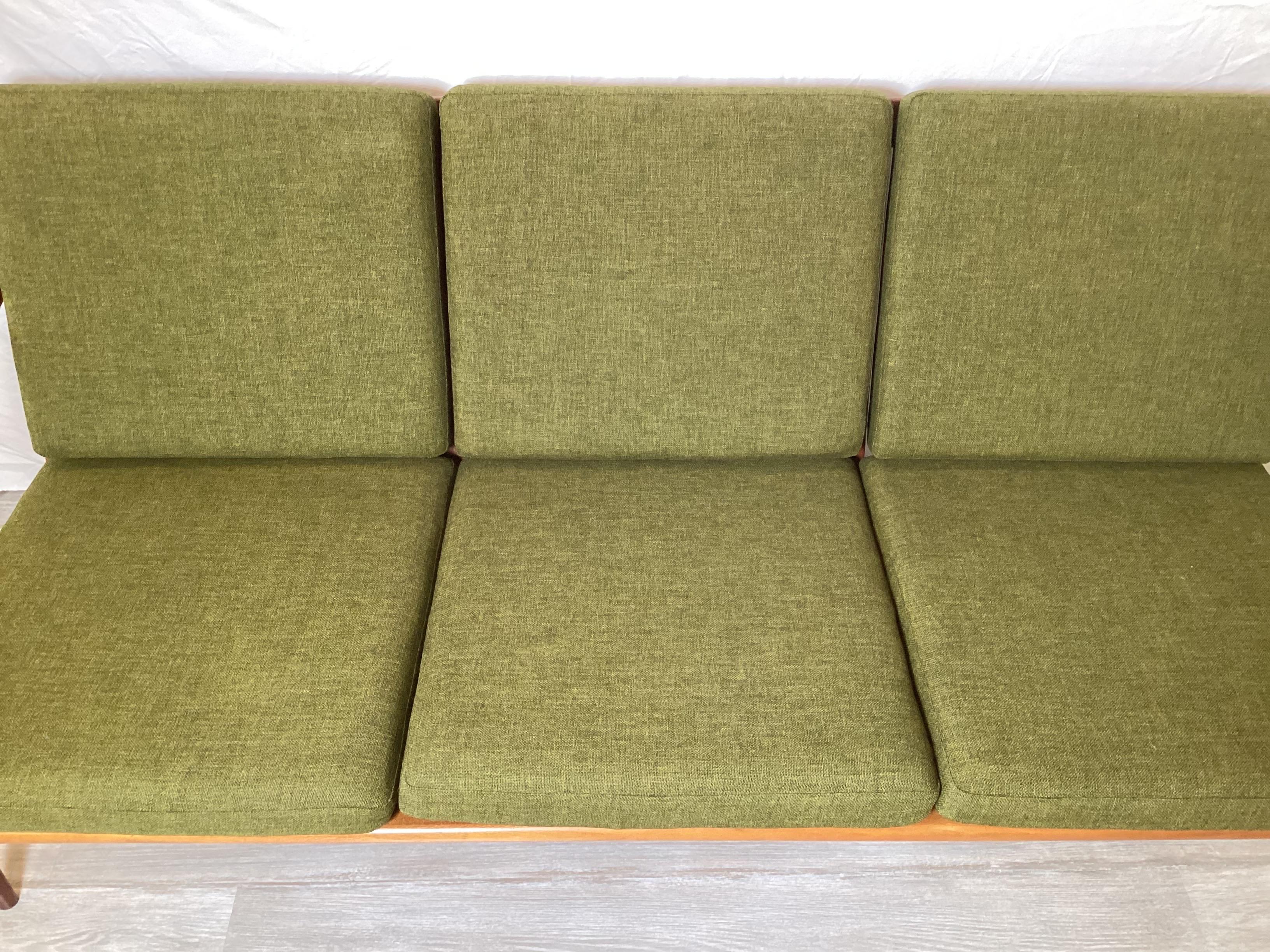 Great Kayser sofa in near pristine condition.  Original Danish wool fabric similar to a Hallingdal. Teak frame with sleek Danish modern lines.  A perfect fit for a mid-century living space.  Back of sofa is finished so sofa can be floated in the