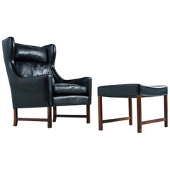 Fredrik Kayser Black Leather and Rosewood Wingback Lounge Chair and Ottoman