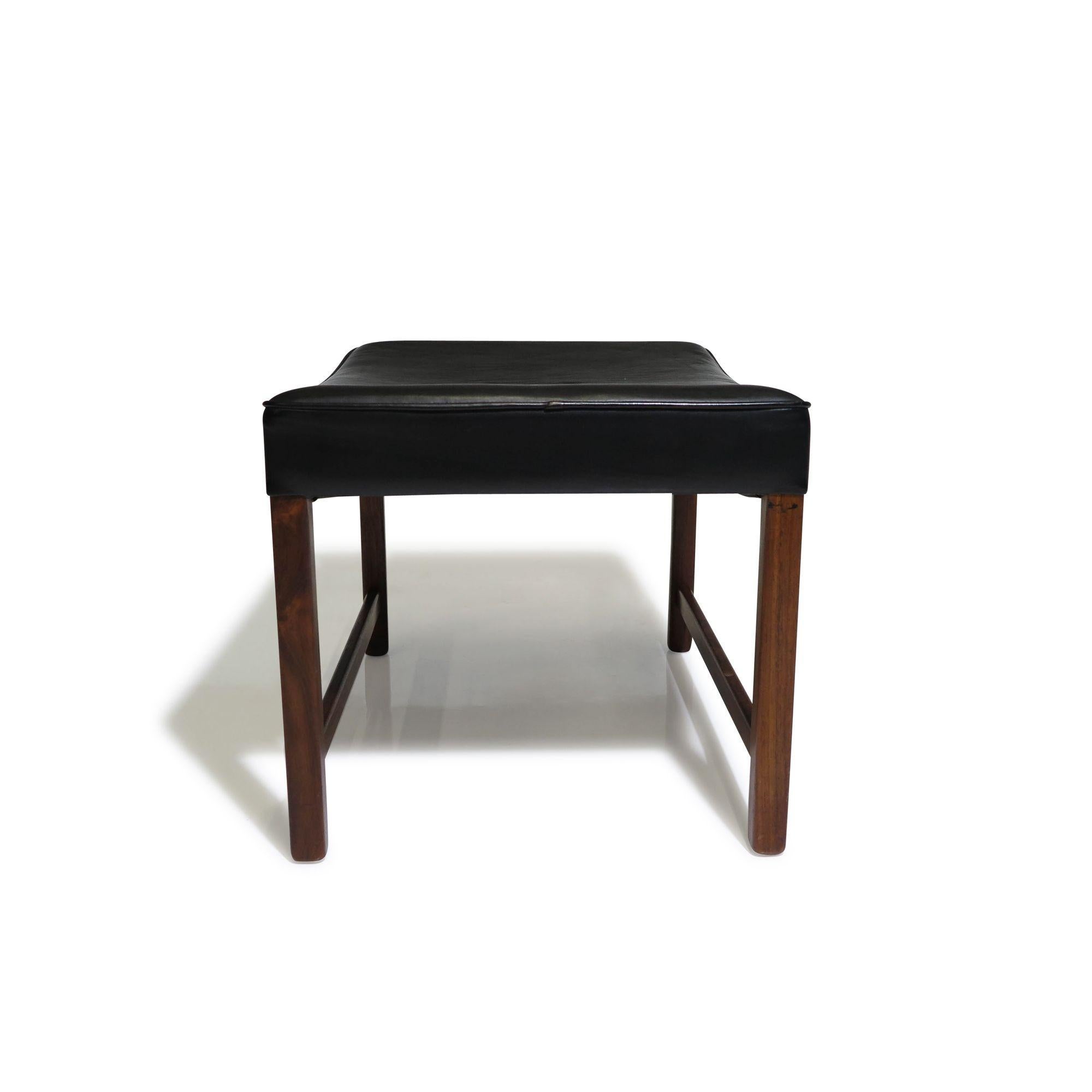 Solid rosewood framed ottoman by Fredrik Kayser for Vatne Møbler, Norway. The bench is upholstered in the original black leather.
Measurements
W 22,25’’ x D 17’’ x H 15,5’’
Seat Height 14,75''