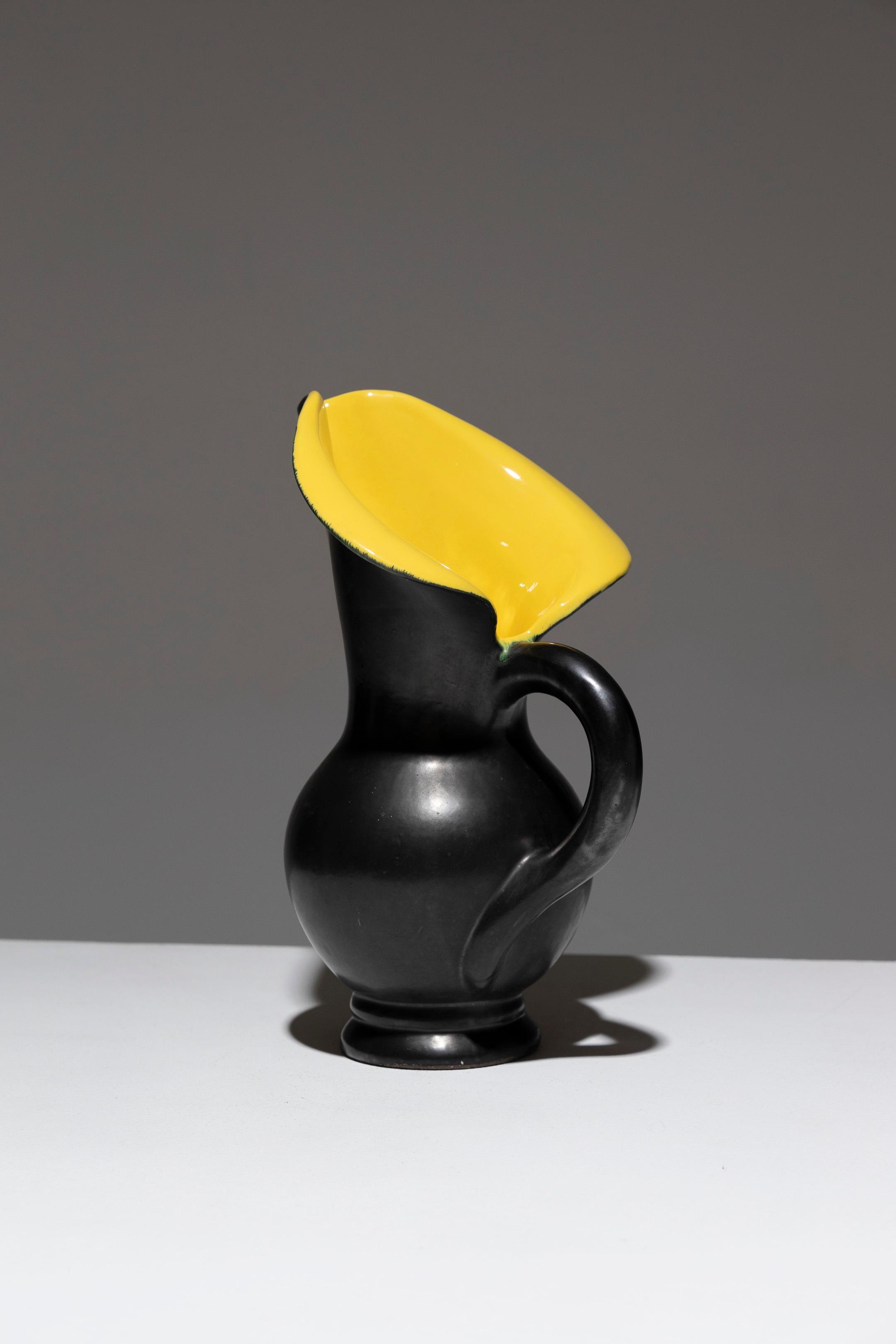Free-Form Pitcher in Ceramic, Vallauris, 1950s, in the style of Pol Chambost. Featuring wide, flared, and rolled edges. The exterior is a matte black 